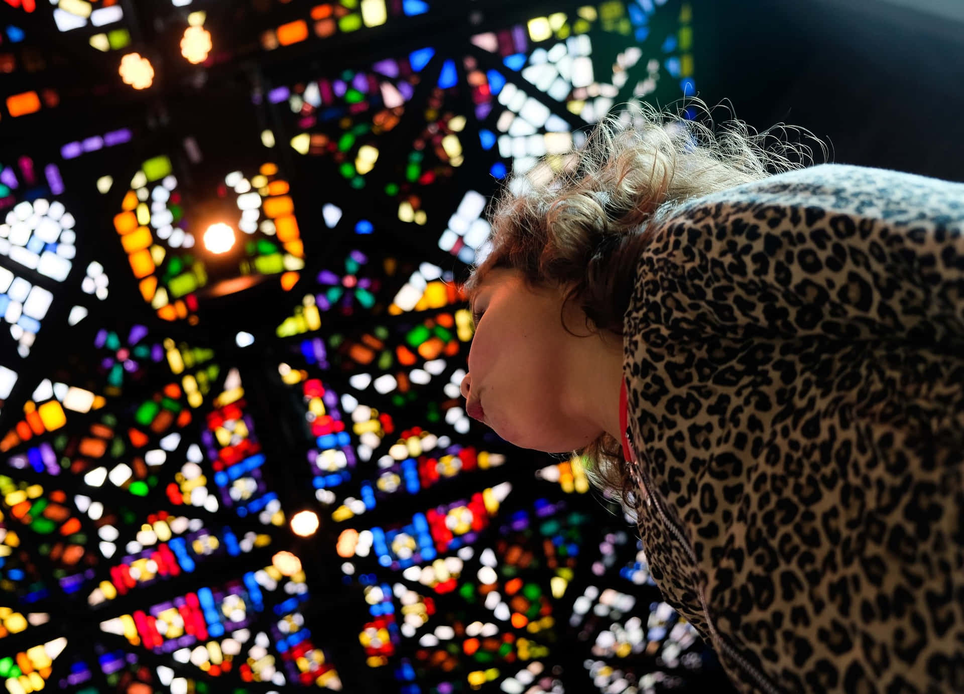 Visitor Admiring Stained Glass Art Wallpaper