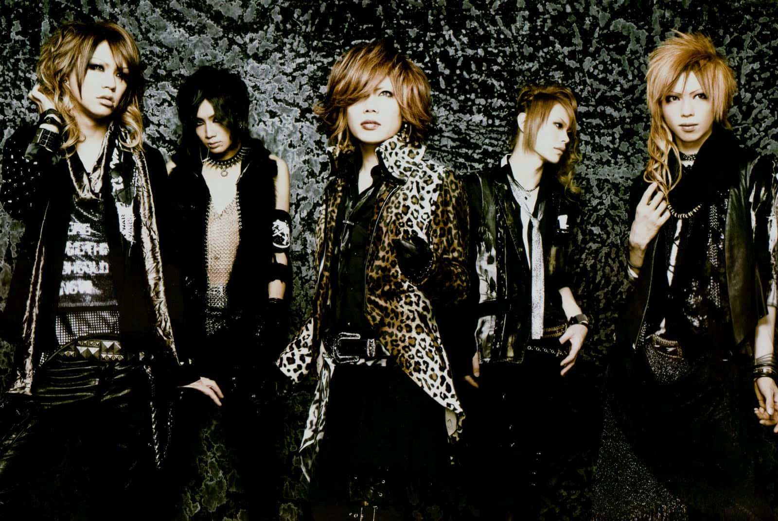 Enigmatic Visual Kei Performers on Stage Wallpaper