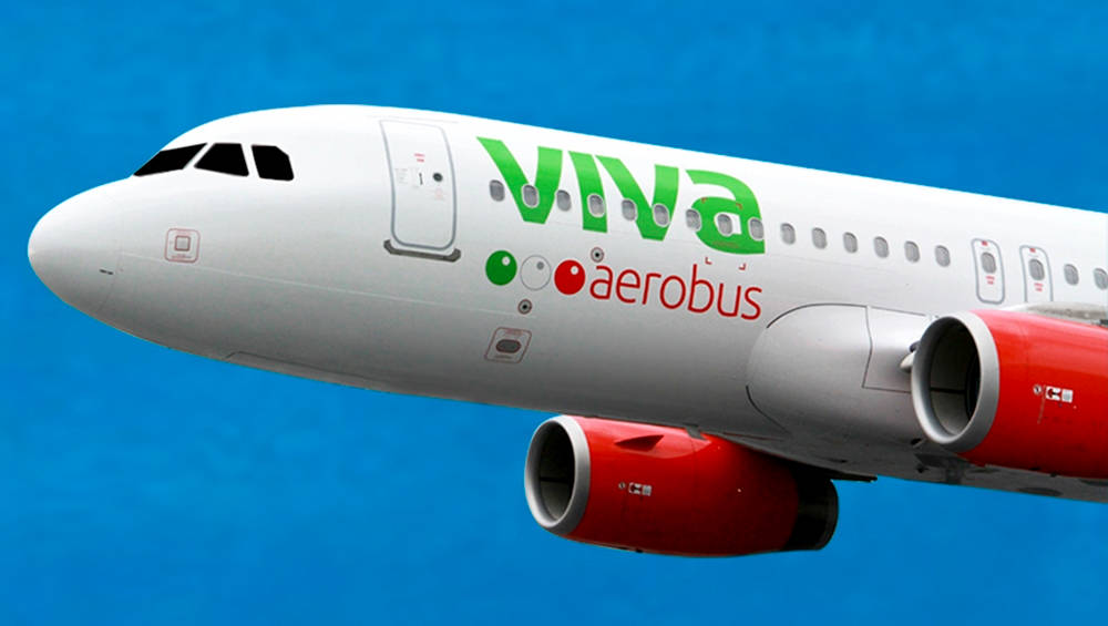 Viva Aerobus airplane in mid-flight with logo prominently displayed Wallpaper