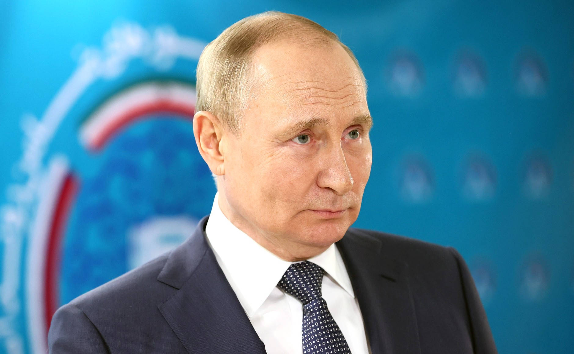 Vladimir Putin Against Blurry Blue Backdrop Wallpaper