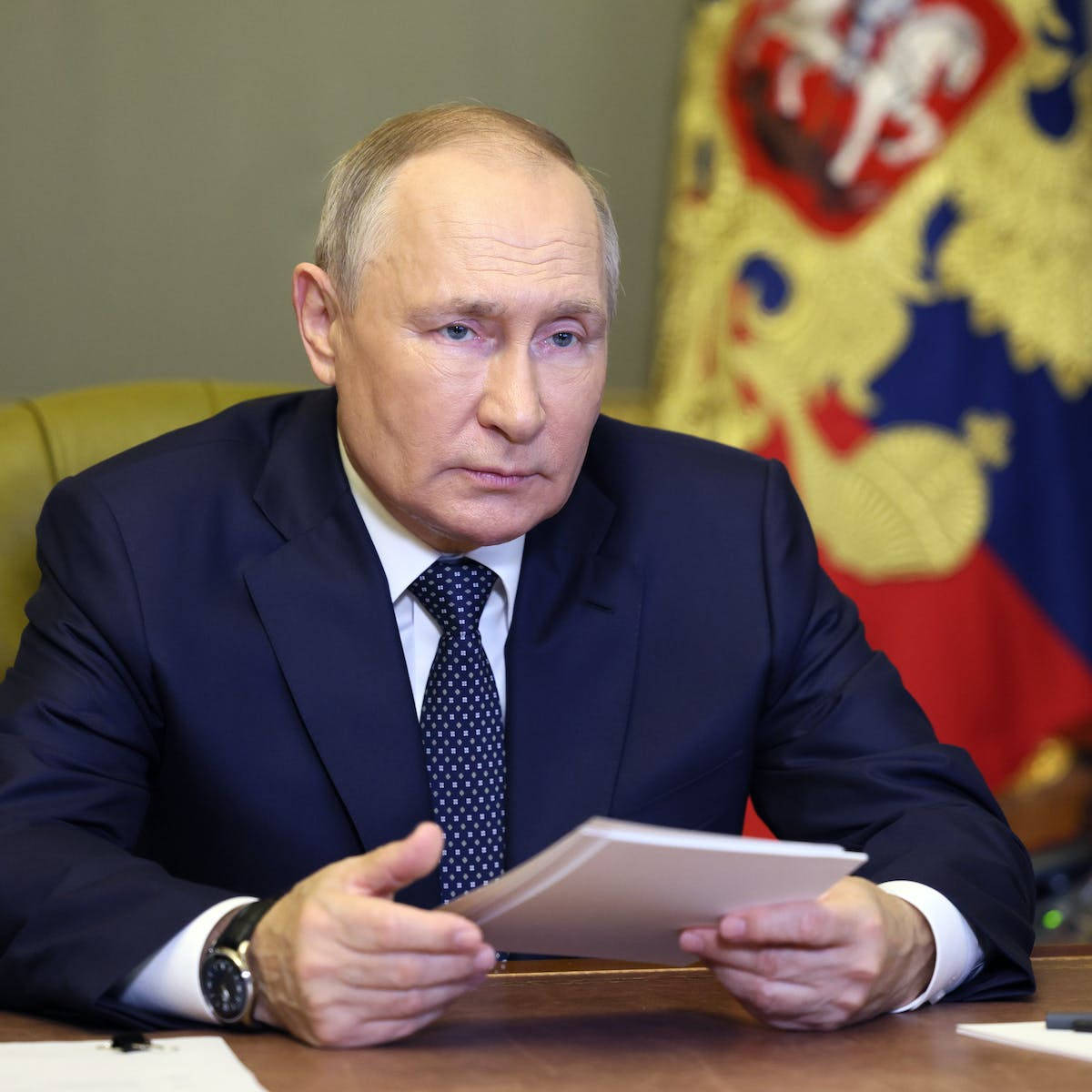 Vladimir Putin Holding A Stack Of Papers Wallpaper