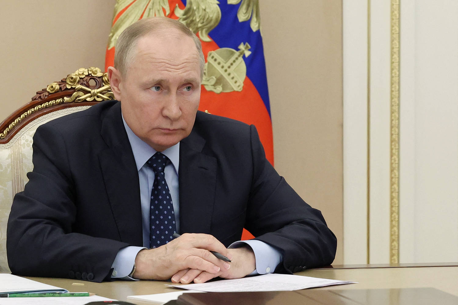 Vladimir Putin Looking Intently During A Conference Wallpaper