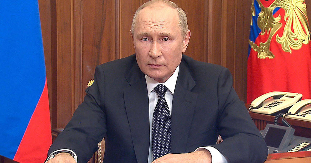 Vladimir Putin With Hands On Table Background