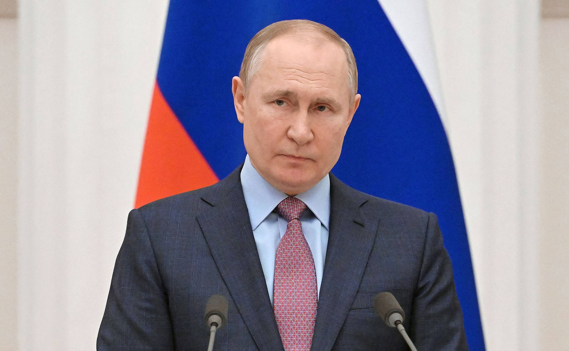 Vladimir Putin With Red And Blue Flag Wallpaper