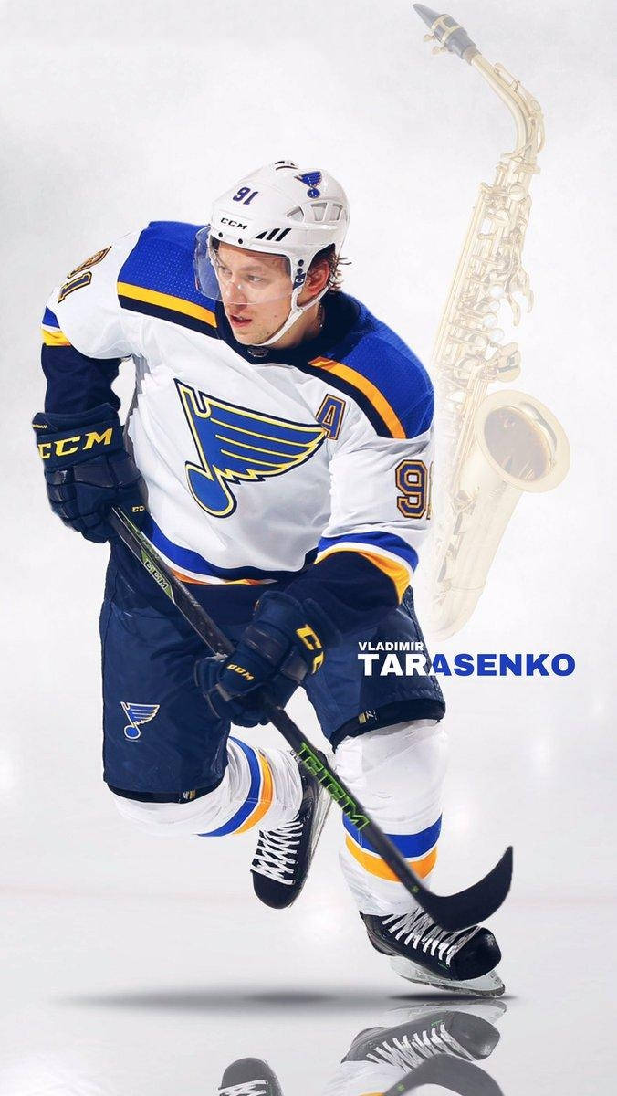 Vladimir Tarasenko Glider Med At Holde Hockey Stave Med Refleksion og Saxofon Wallpaper