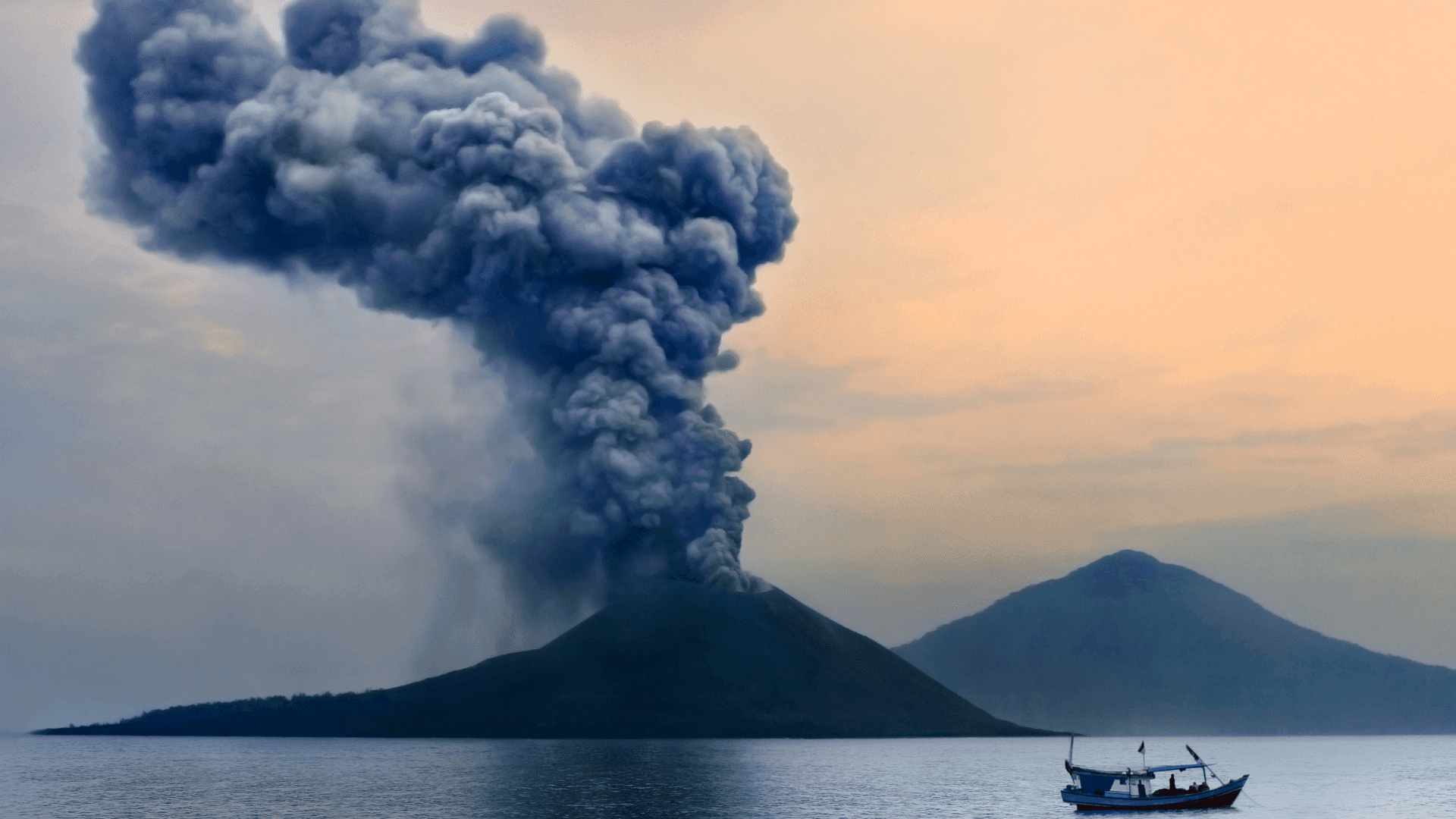 a boat is in the water near a volcano Background — A volcano erupts with a massive ash cloud over a calm sea as a small boat sails nearby at sunset.