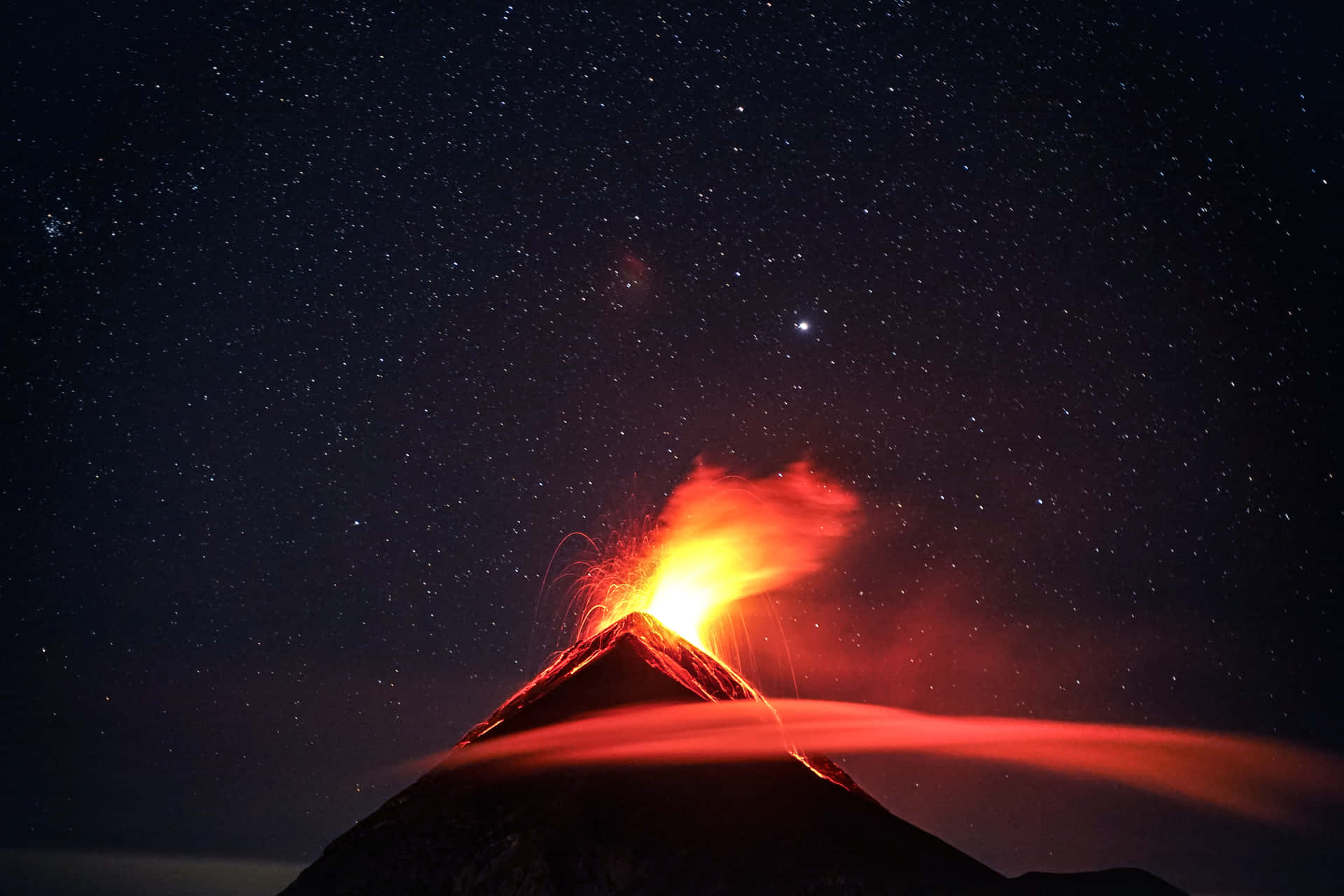 "Illuminated Volcano Erupting in Nature's Fury"