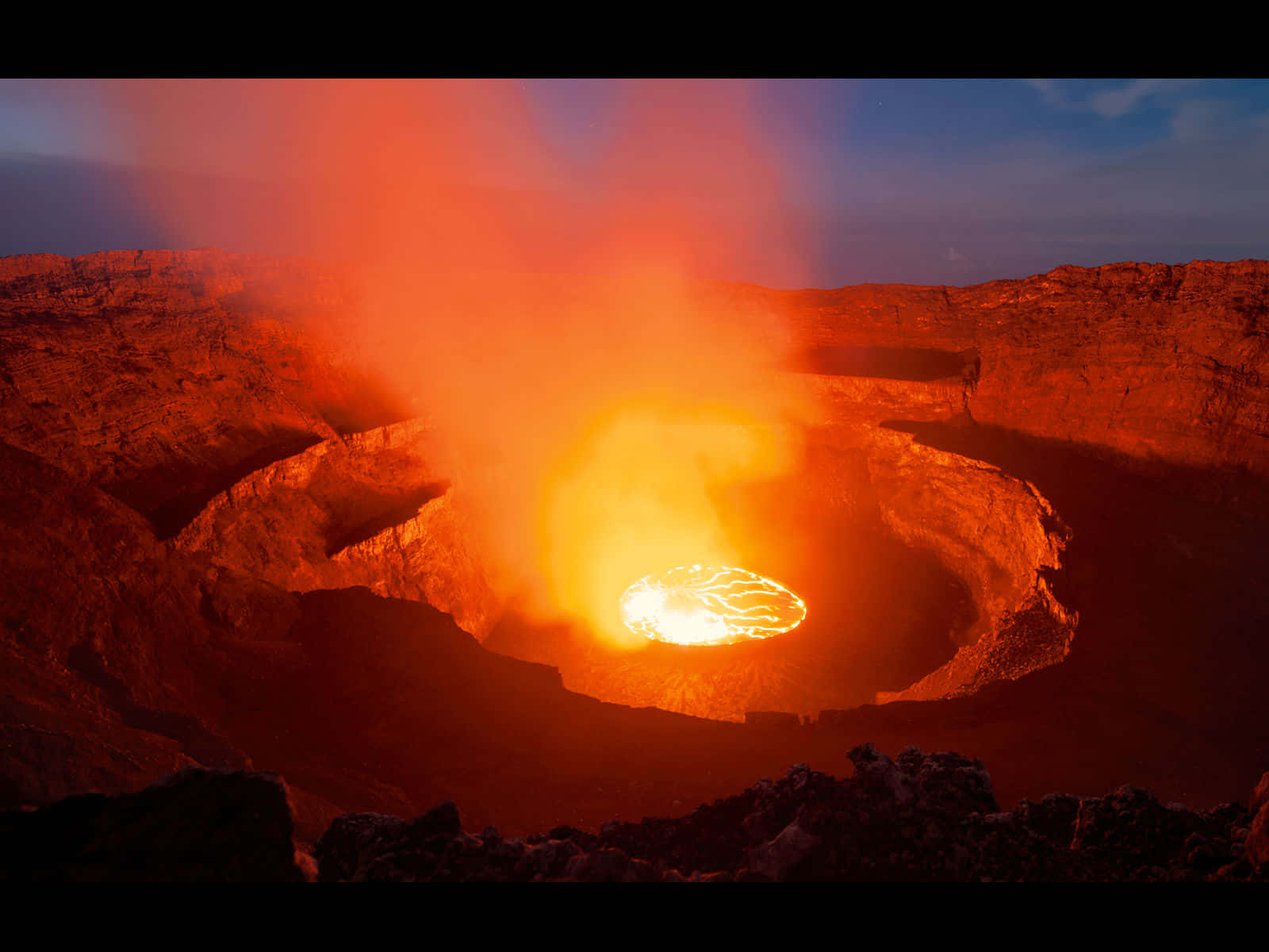 Witness the fury of nature's power with this stunning view of an active volcano.