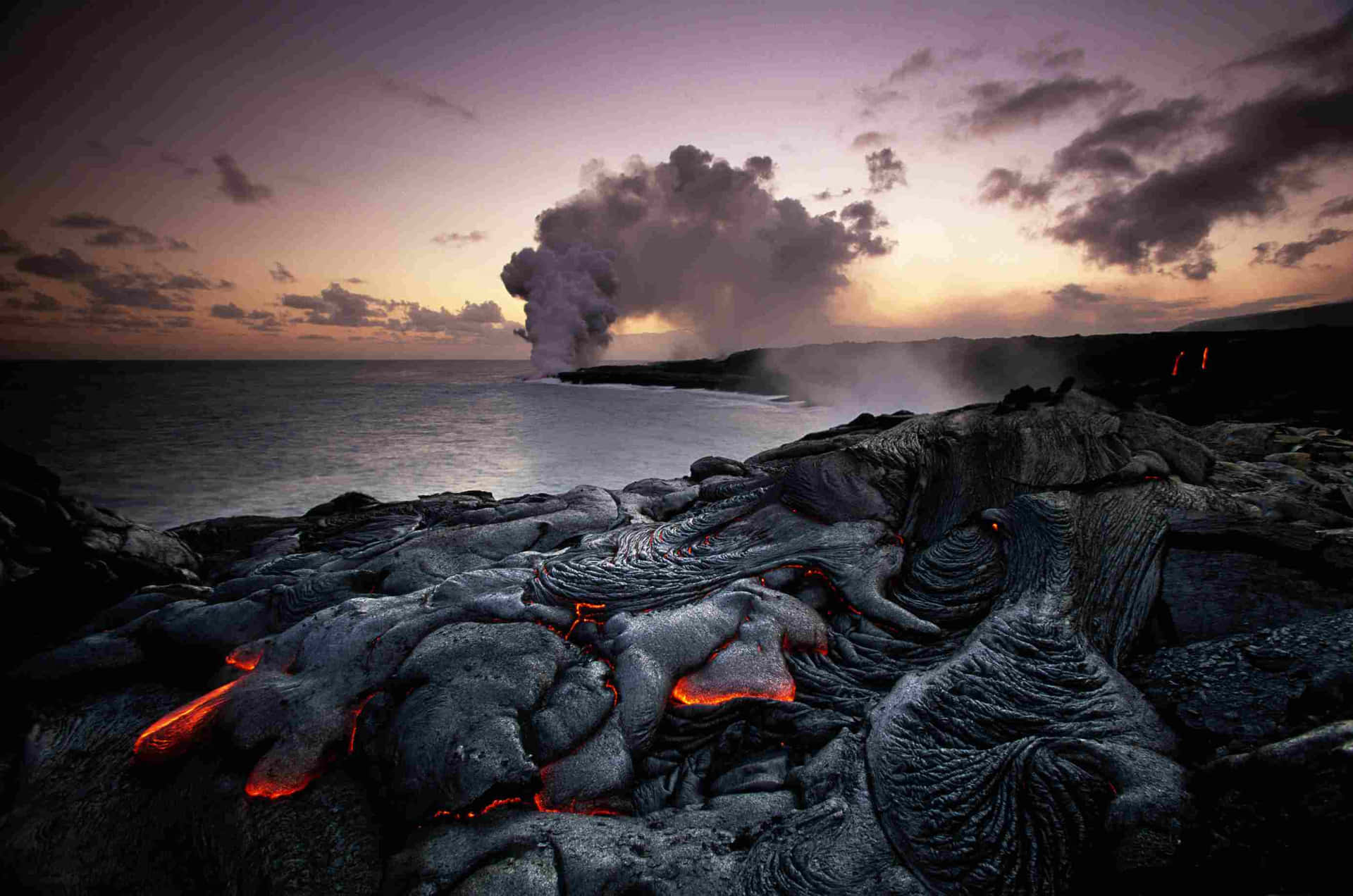 Lava Flows On The Ocean At Sunset