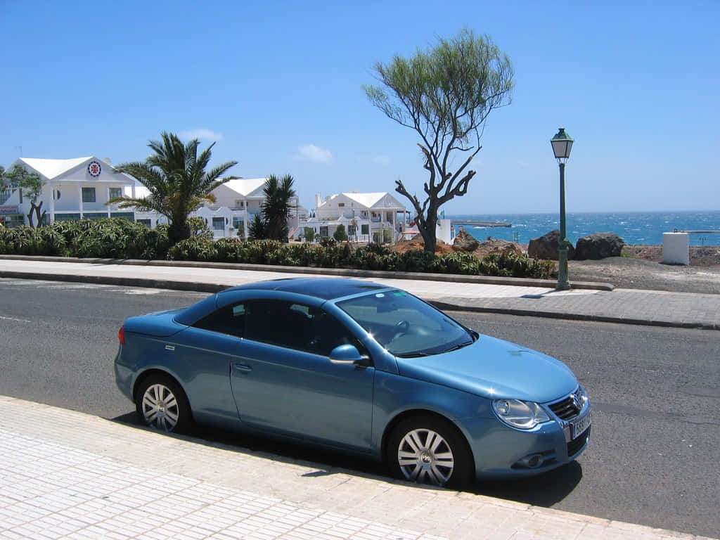 Volkswagen Eos Bleue Sur Route Côtière Fond d'écran