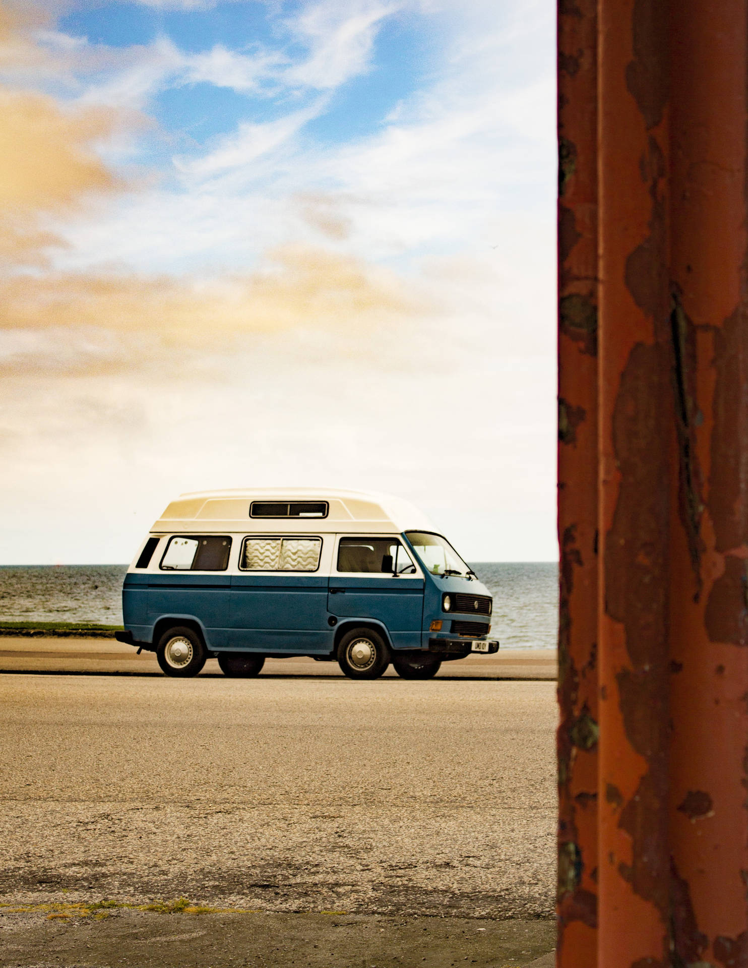 A nostalgic ride with a Volkswagen Type 2, embracing the 70s retro aesthetic. Wallpaper