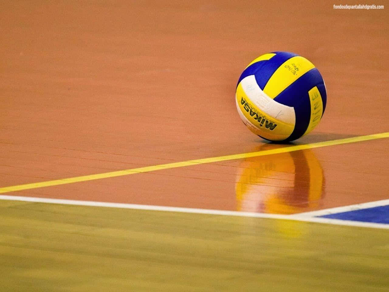 A Volleyball Ball Is Sitting On The Court Wallpaper