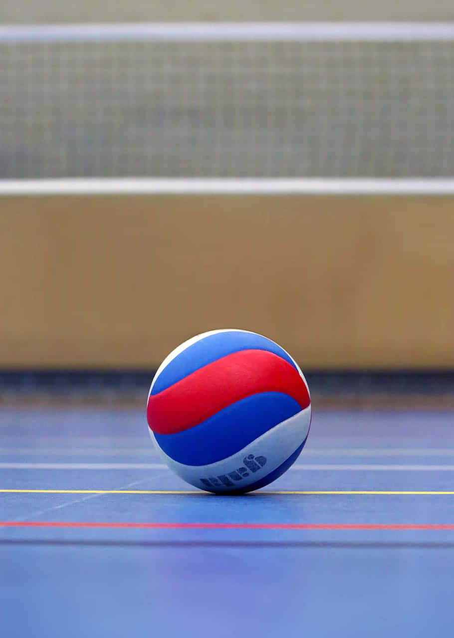 En volleyballbold er klar til at blive serveret. Wallpaper