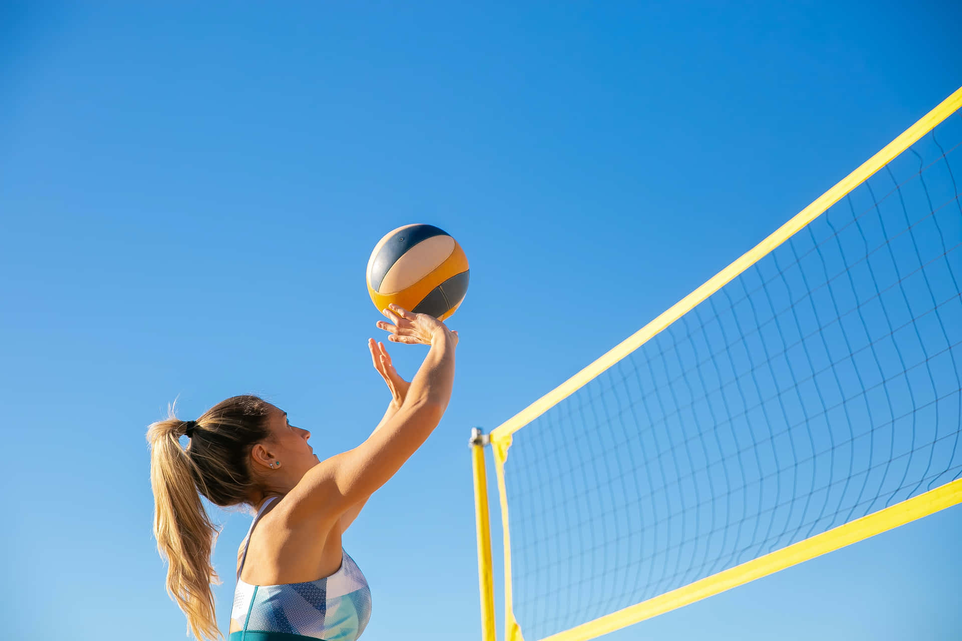 Billeder af volleyball, der skaber uendelig energi på væggen