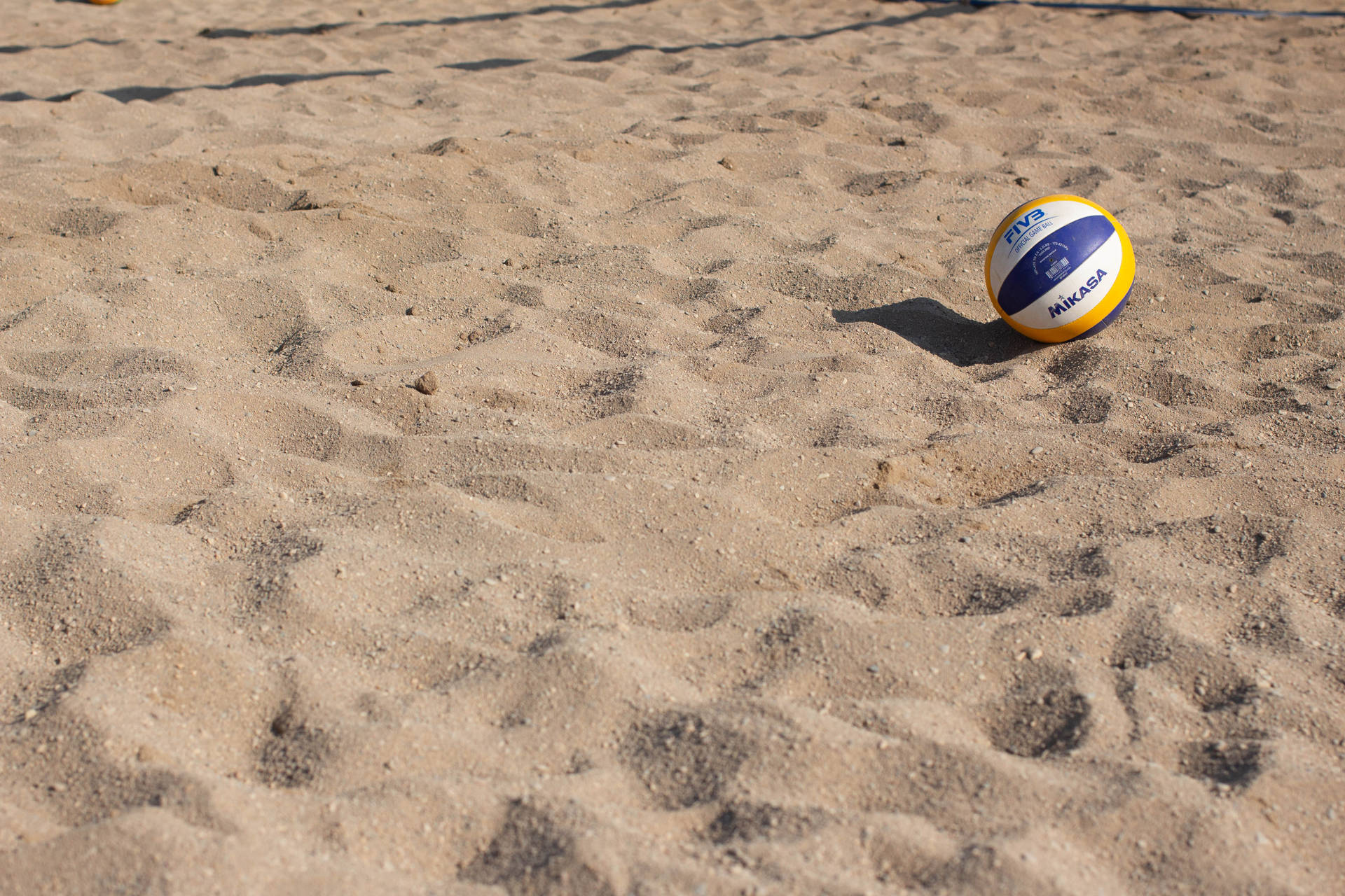 Volleyball On Beach Sand Wallpaper