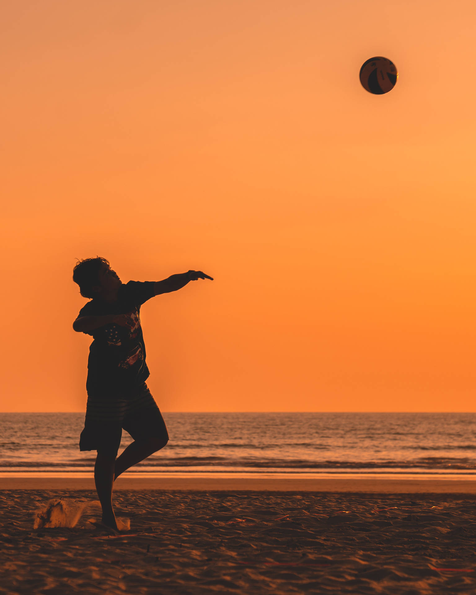 Volleyball Silhouette In Tangerine Beach Wallpaper
