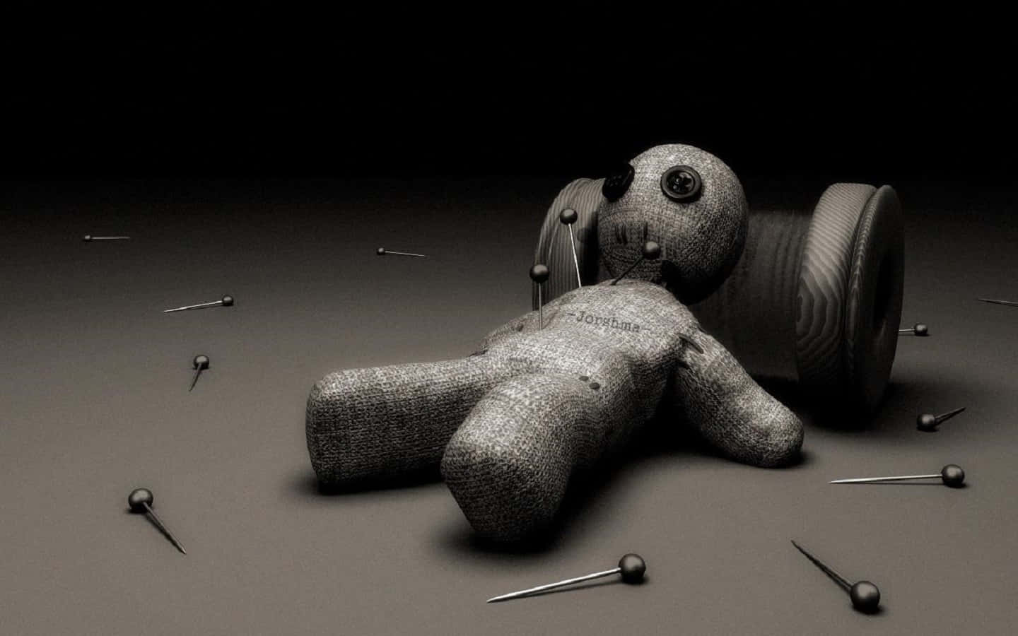 Three mysterious Voodoo Dolls on a wooden surface Wallpaper