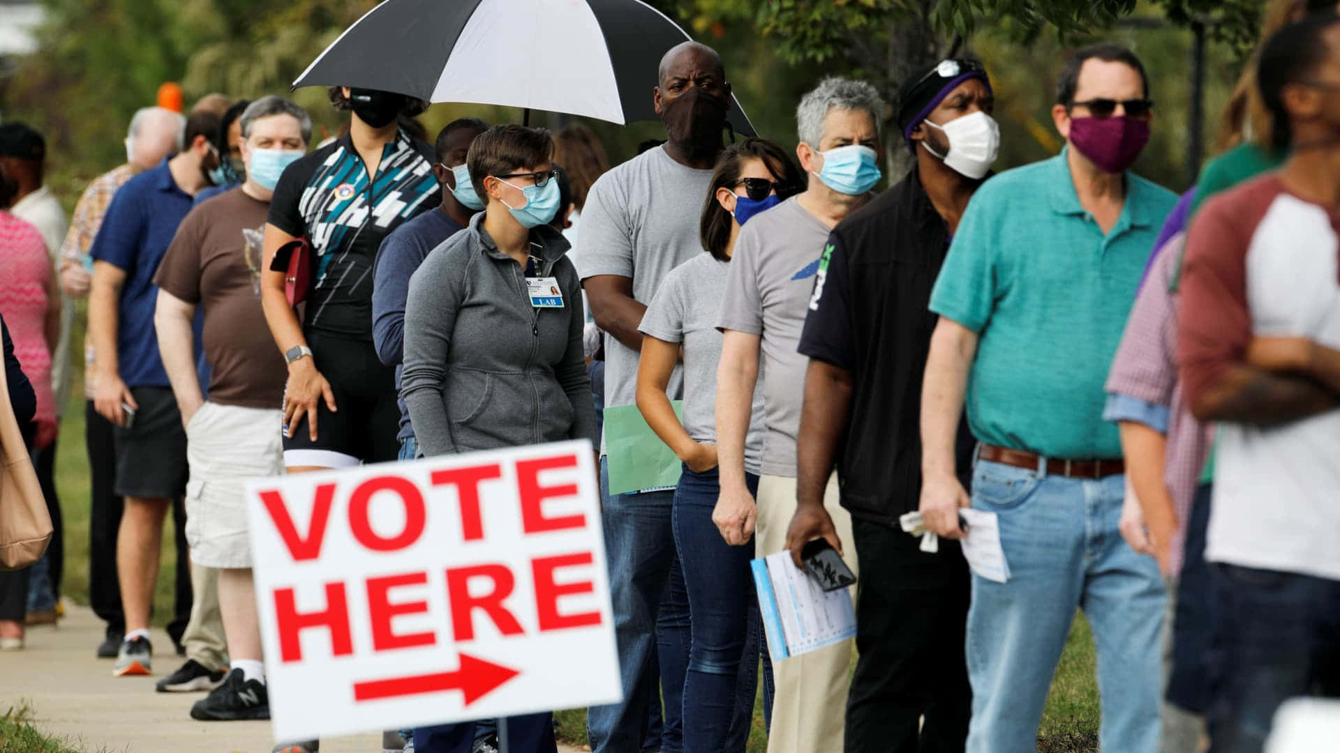 People Are Lined Up To Vote In A Polling Place