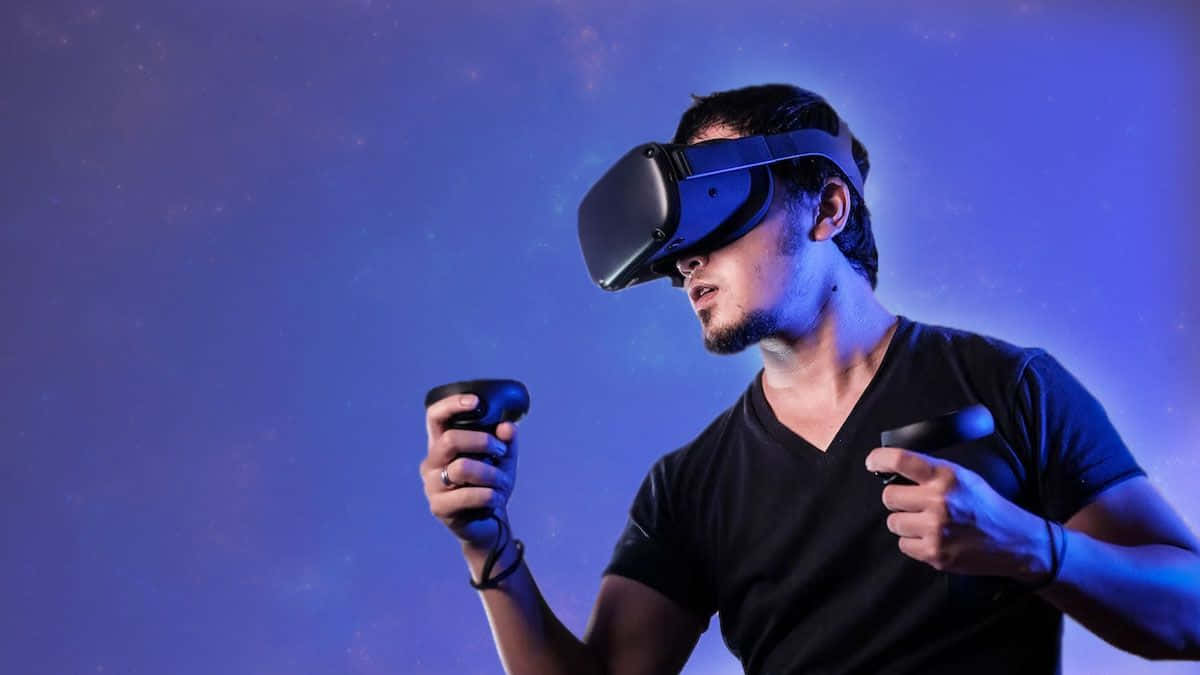 A Man Holding A Virtual Reality Headset