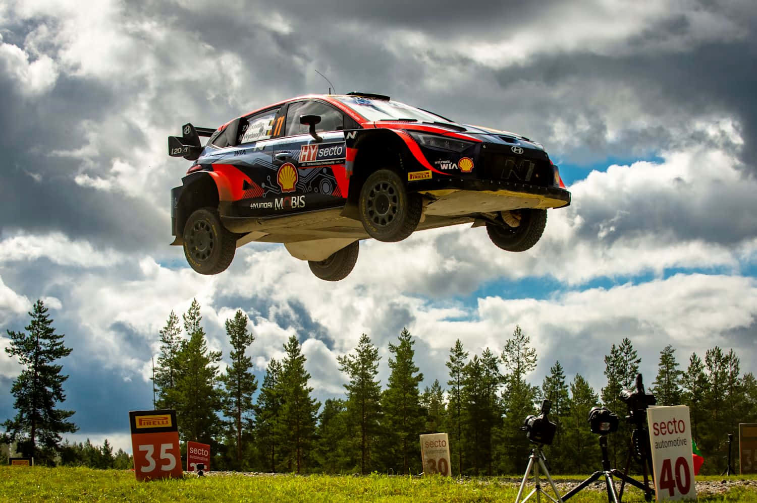 W R C Rally Car Mid Air Jump Wallpaper