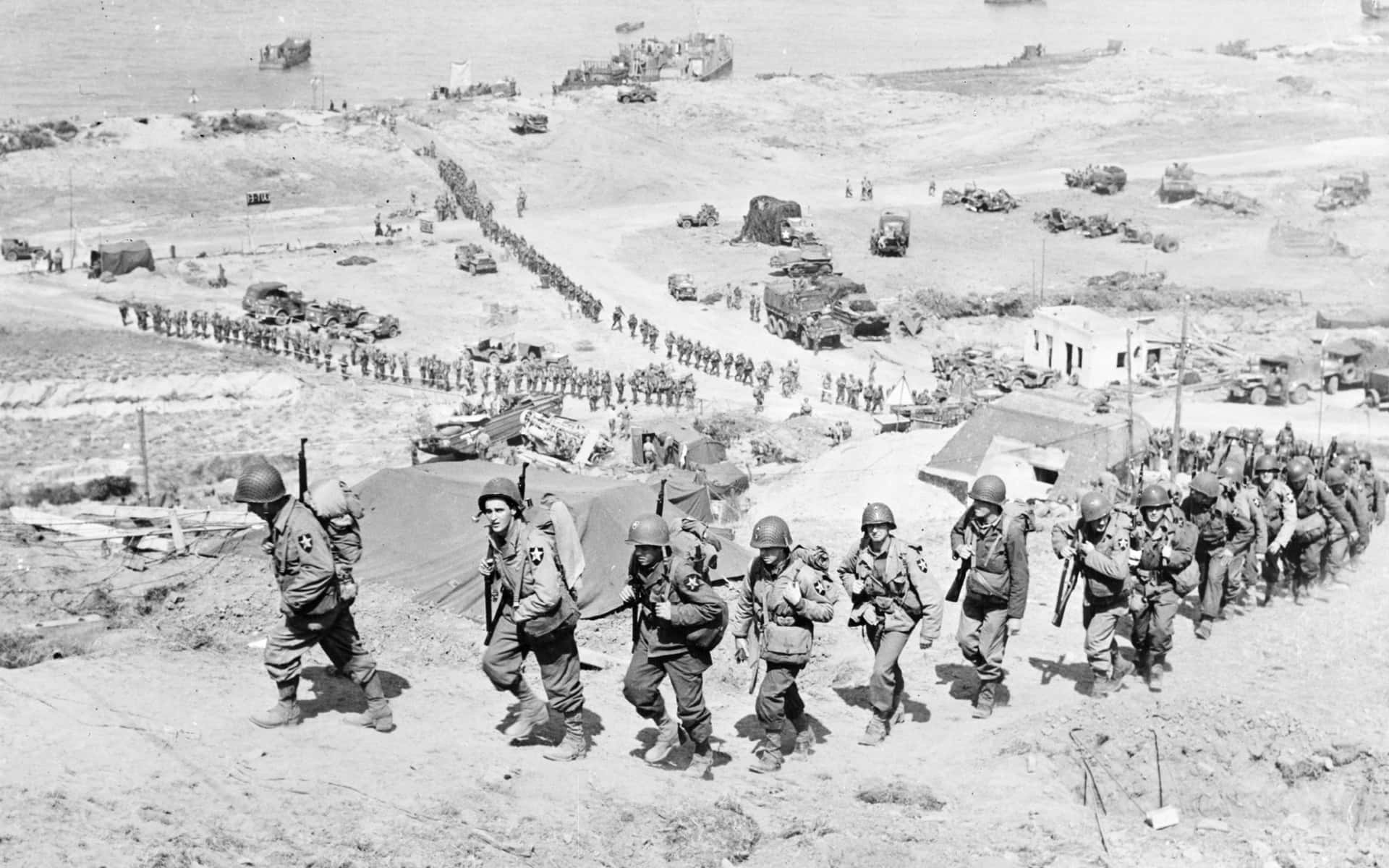 W W2 Soldiers Marchingto Battle Wallpaper