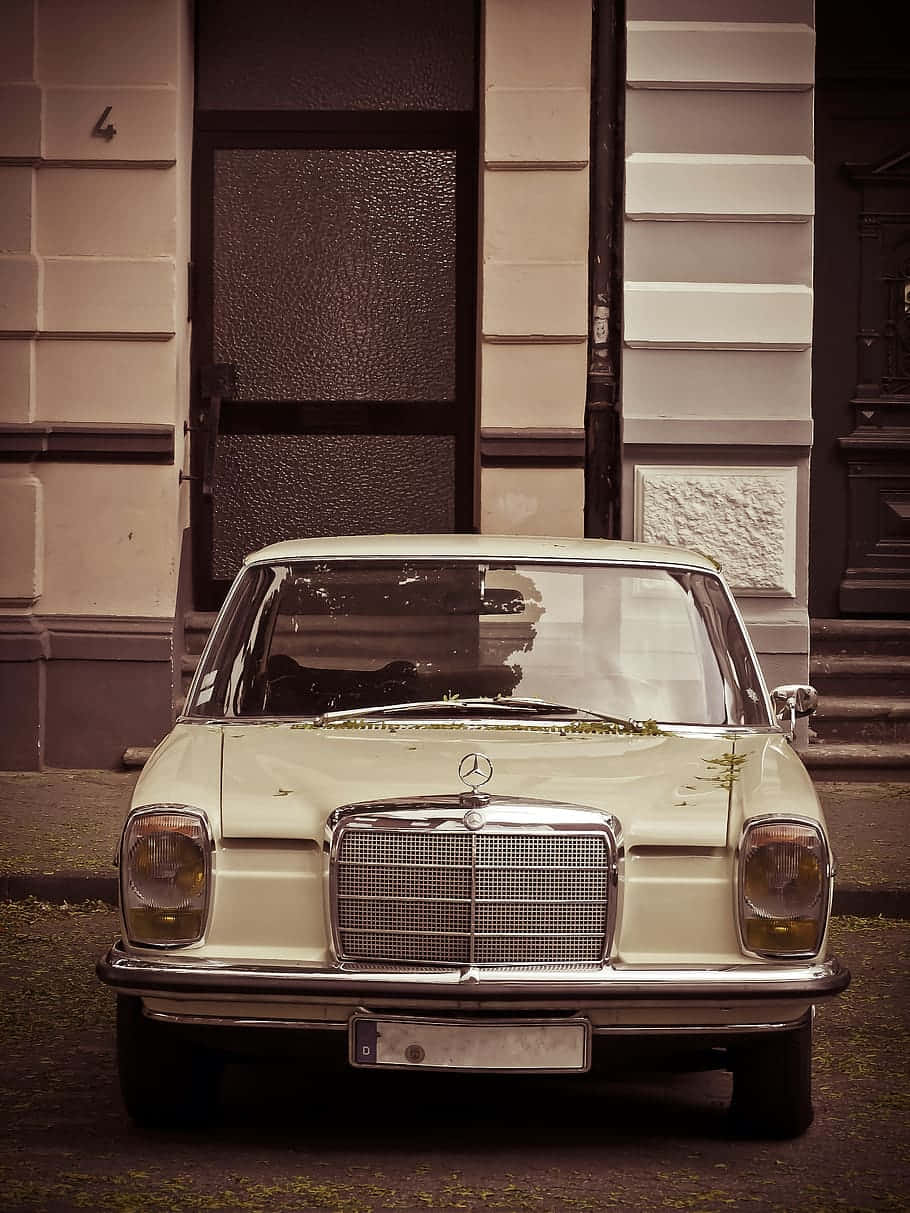 Caption: Vintage Elegance - Old Mercedes-Benz W114 Wallpaper
