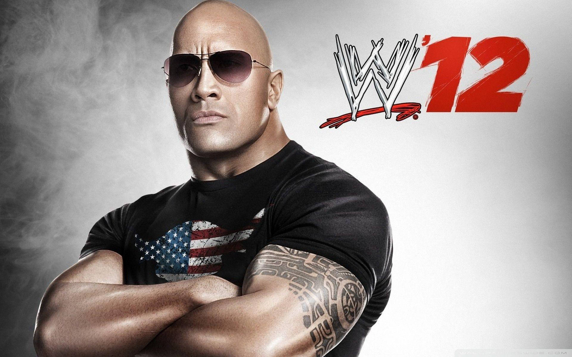 The Rock wows the crowd with his wrestling prowess Wallpaper