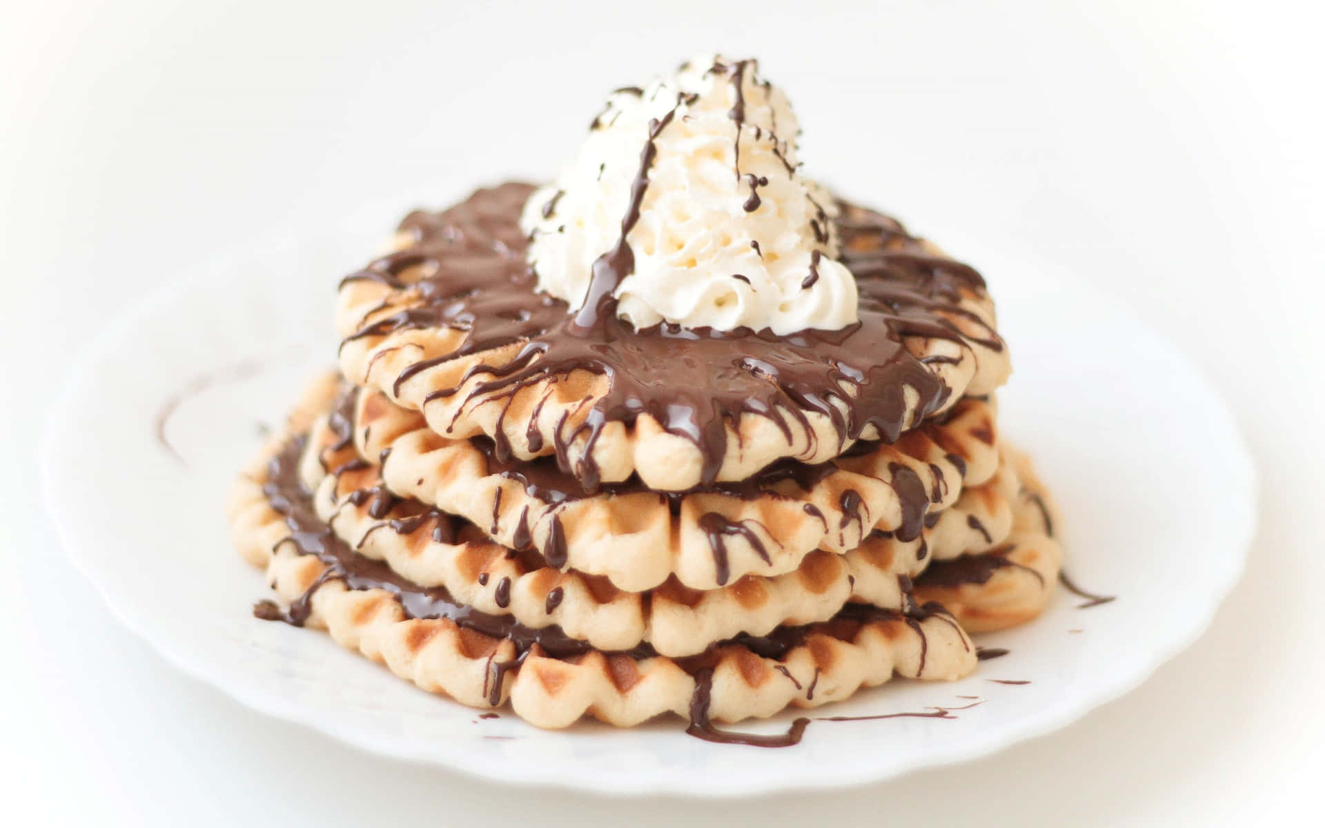 Delicious golden waffles stacked on a plate