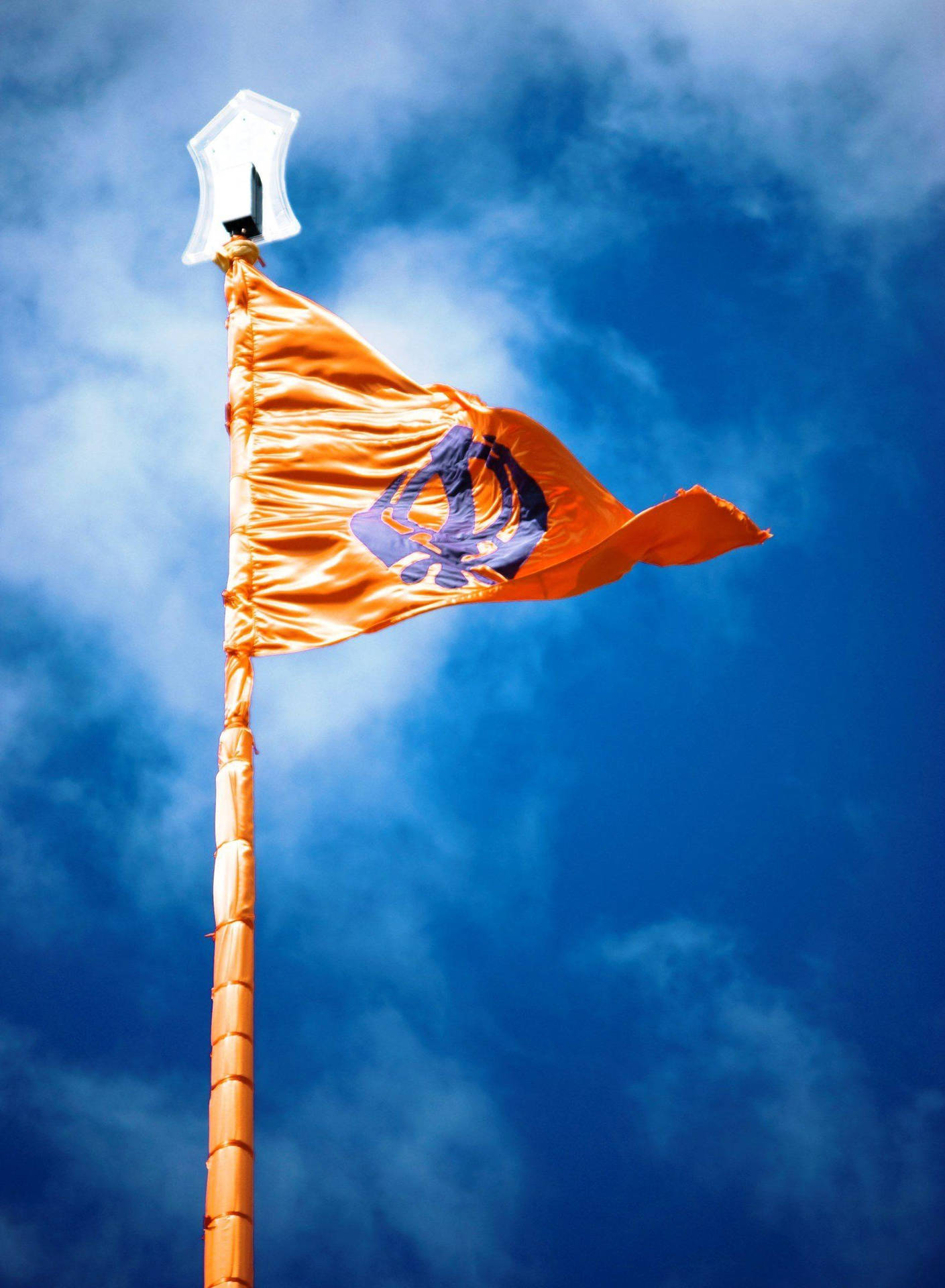 Download Waheguru Sikhism Symbol On Flag Wallpaper 