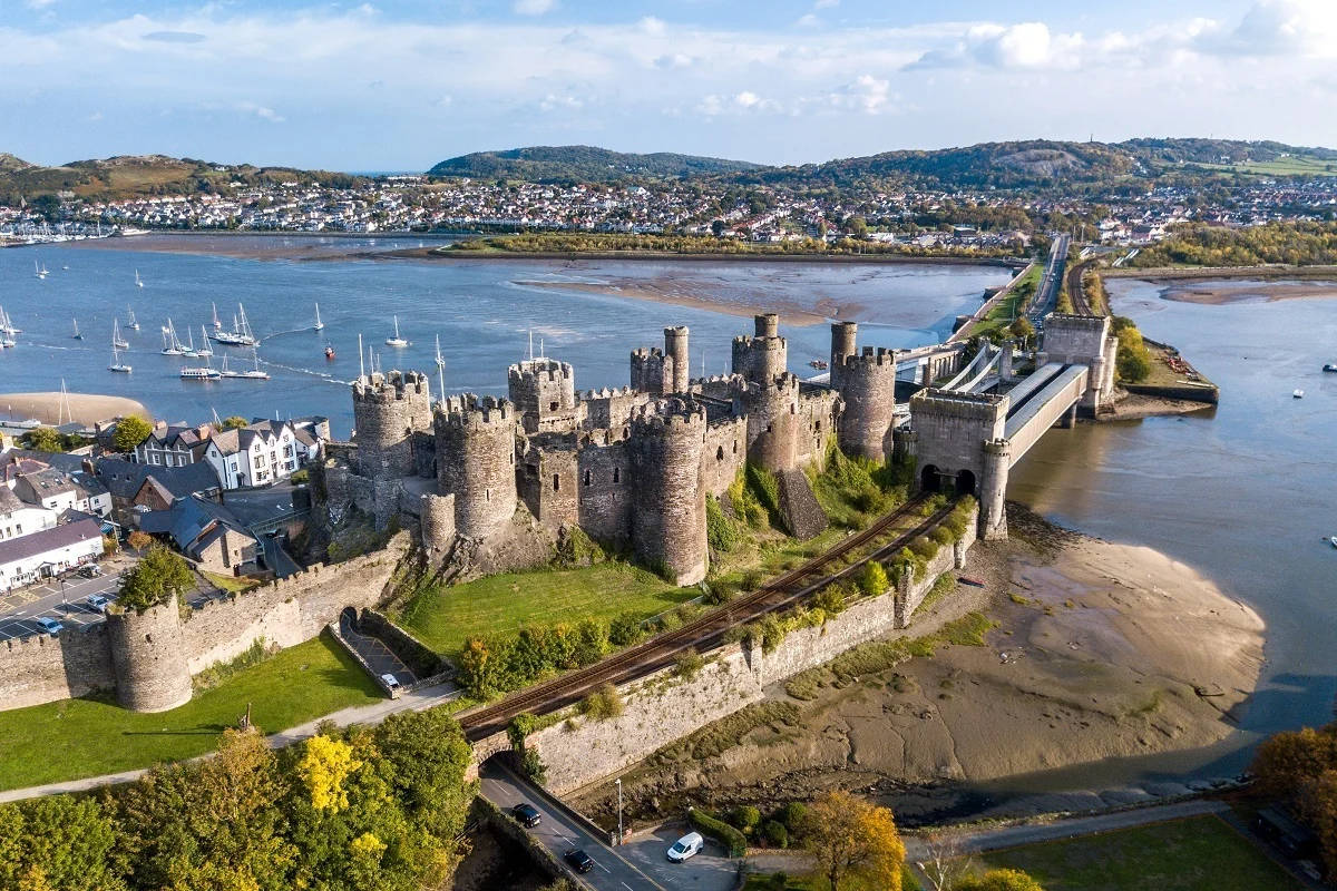 a castle and a river in wales Wallpaper