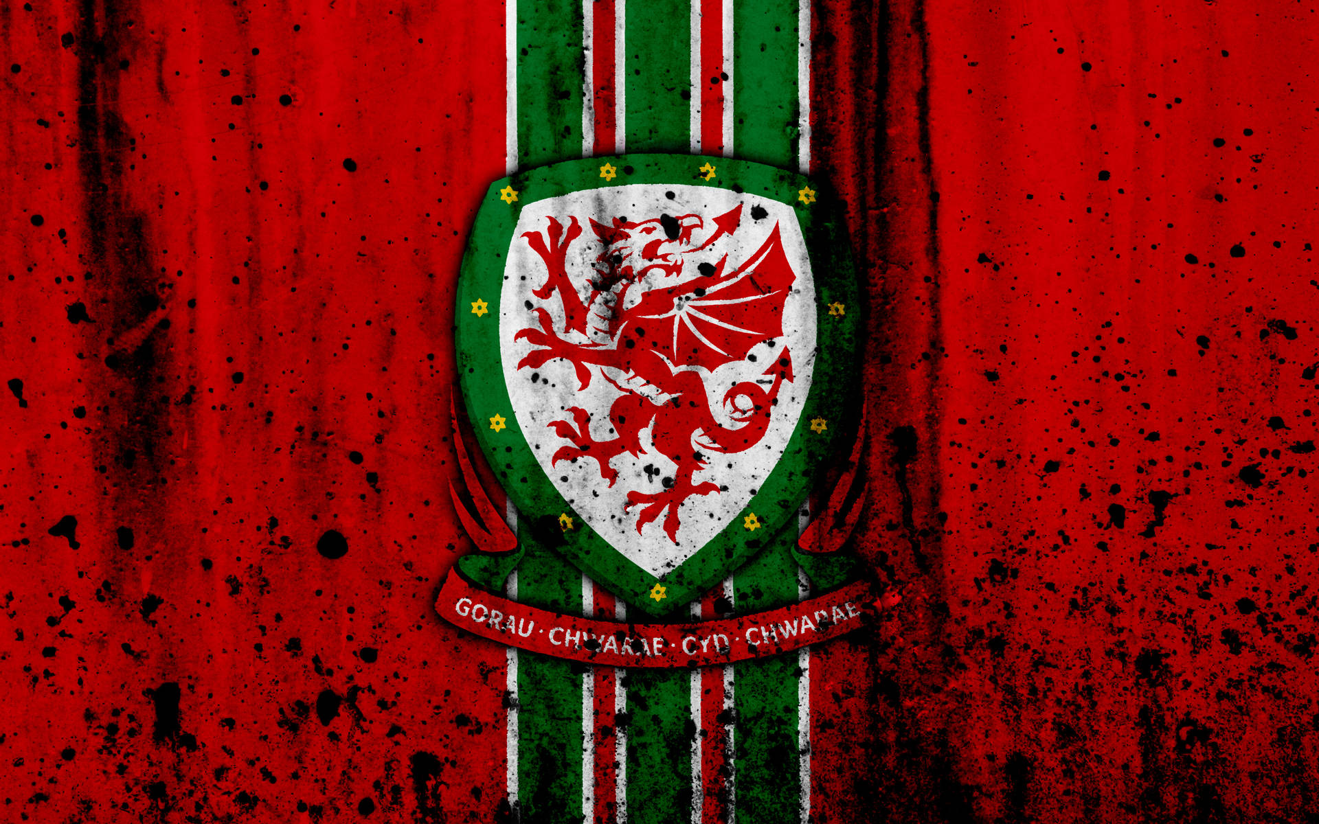 Seleçãonacional De Futebol Do País De Gales Com Brasão Respingado Como Papel De Parede De Computador Ou Celular. Papel de Parede