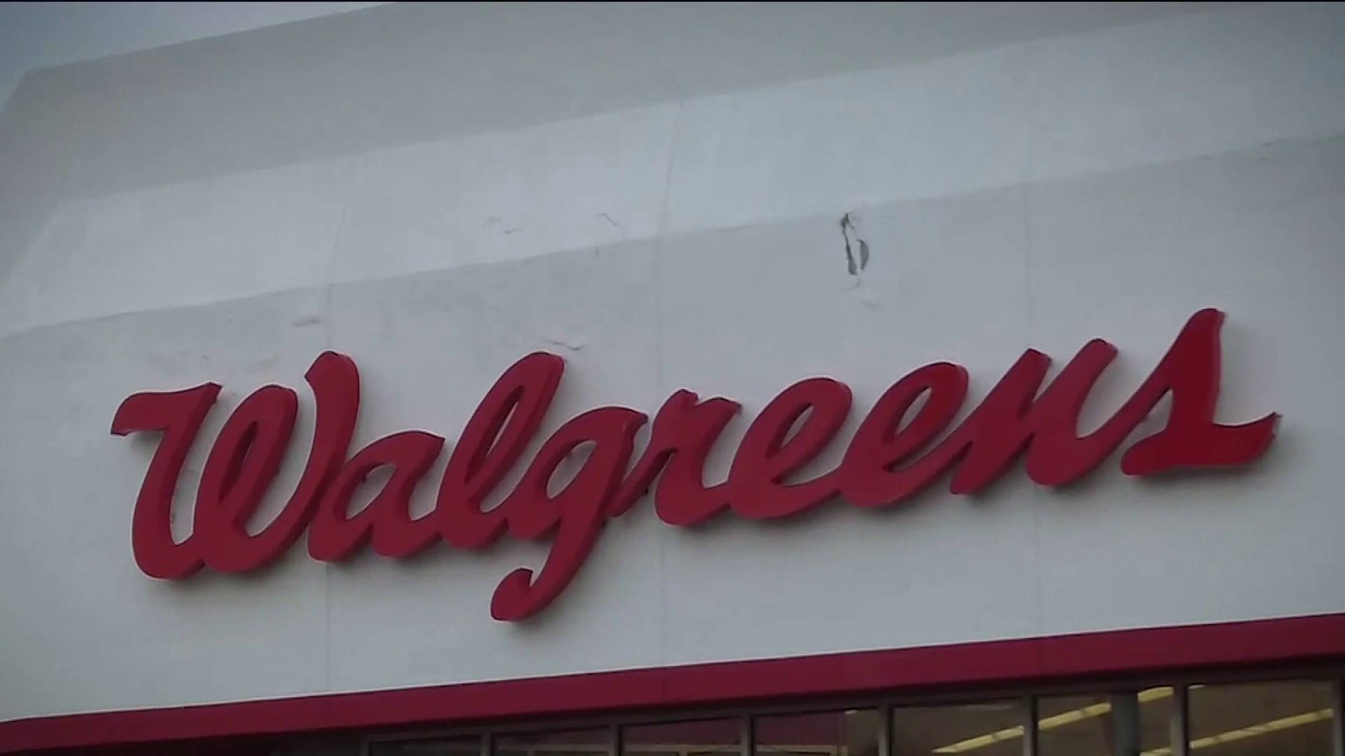 Walgreens Logo On White Concrete Wall Picture