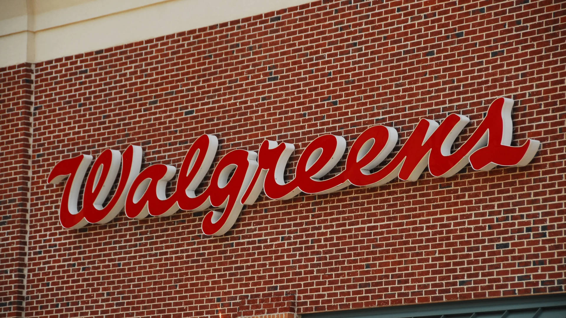 Walgreens Signage Brick Wall Wallpaper