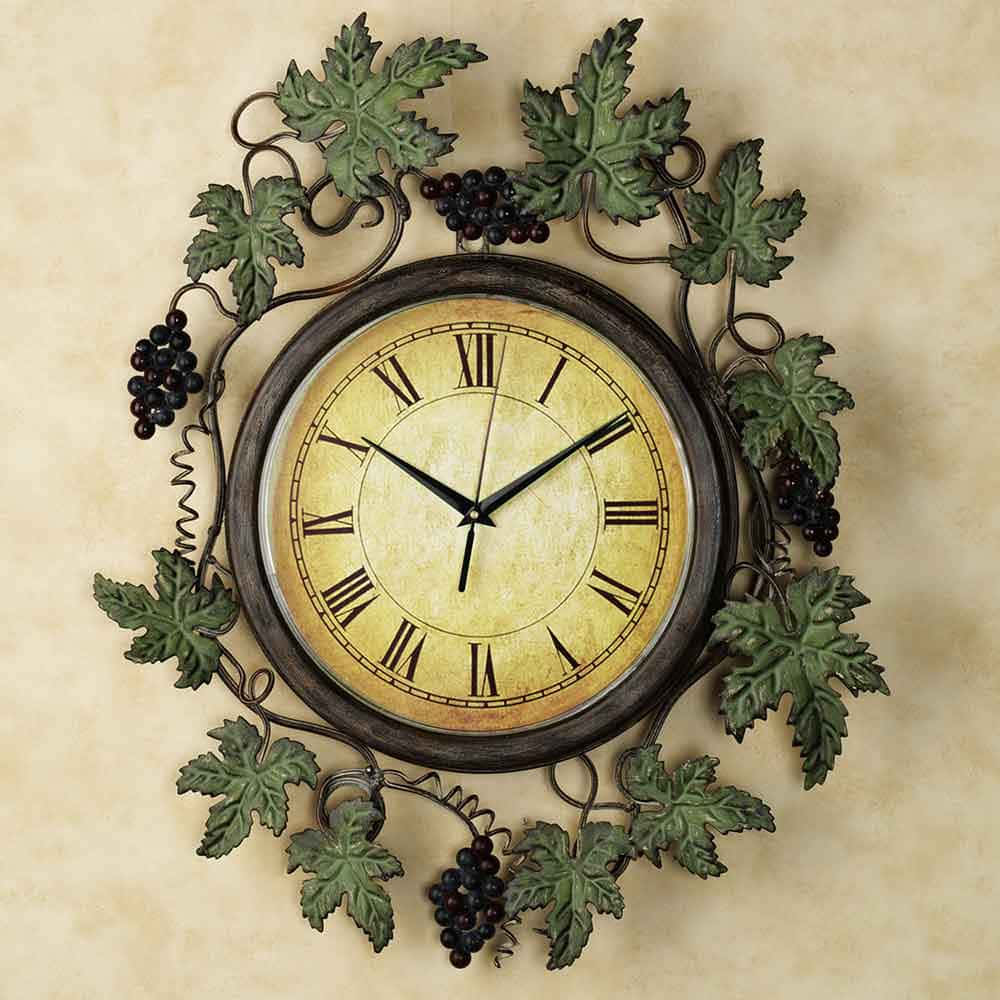 A Wall Clock With Grapes And Leaves On It