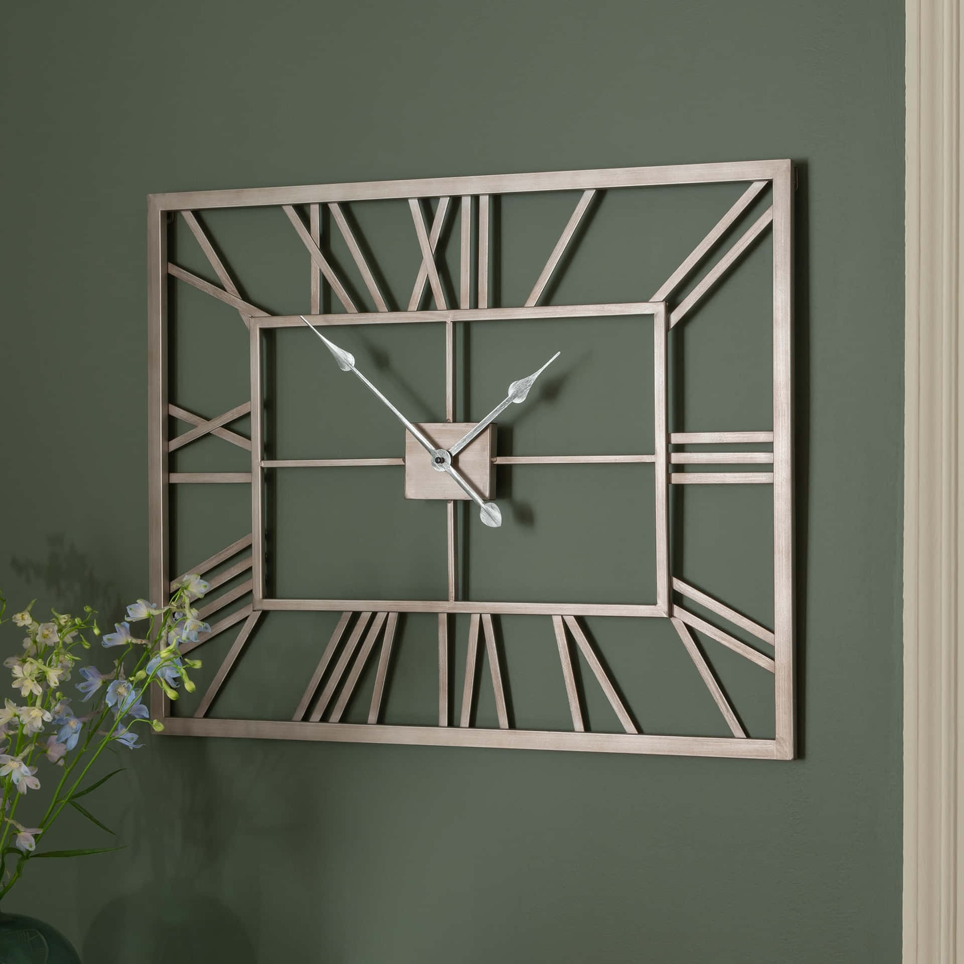 A Wall Clock With Roman Numerals On It