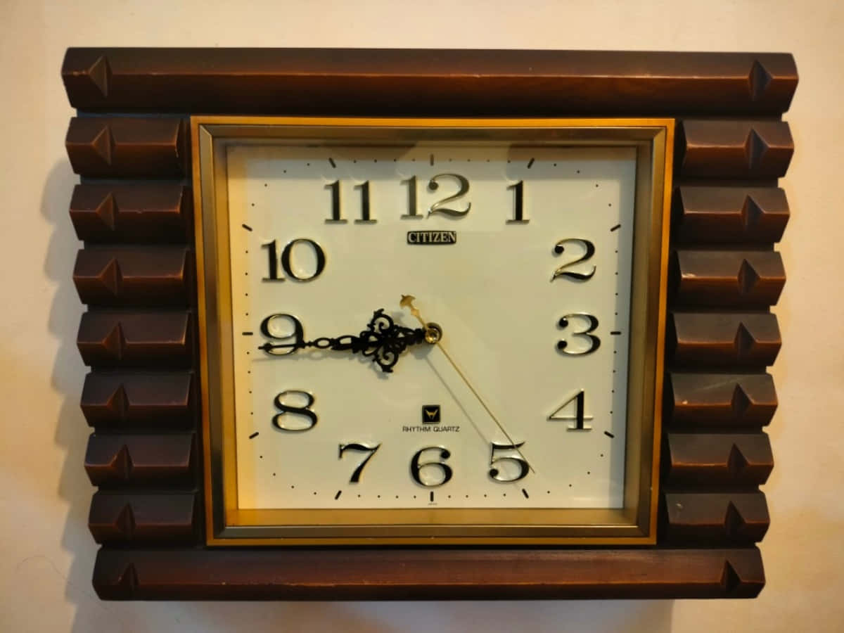 A Wall Clock With A Wooden Frame And Numbers