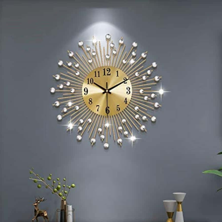 A Gold Wall Clock With A Starburst Pattern