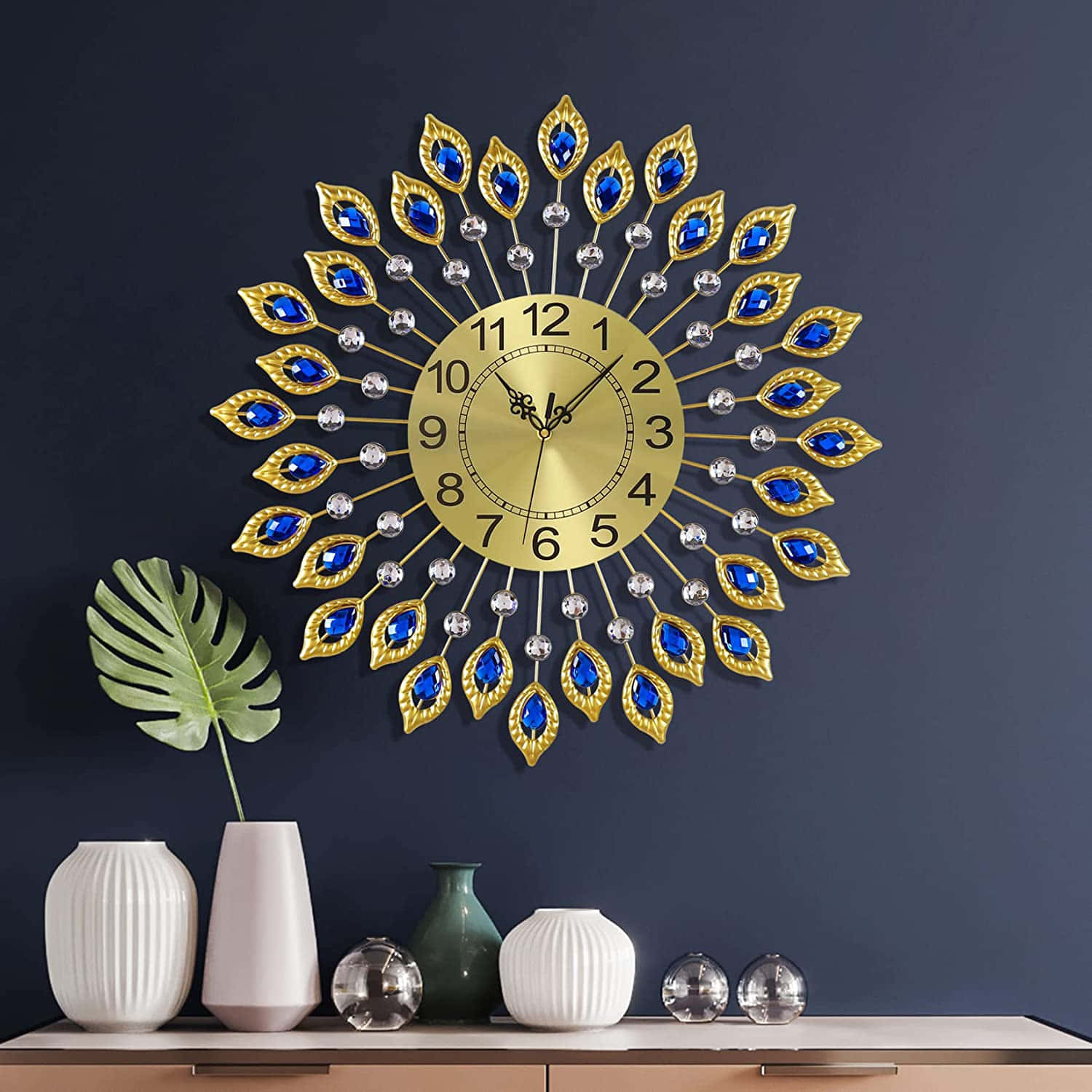 A Blue And Gold Peacock Wall Clock On A Wall