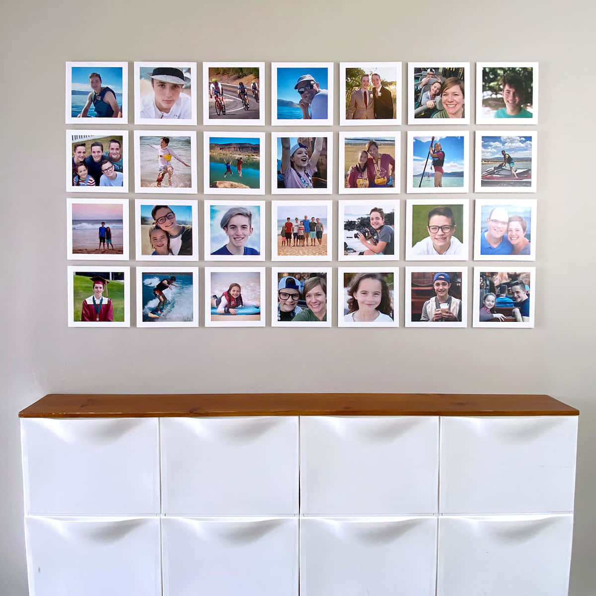 A White Dresser With Pictures On It