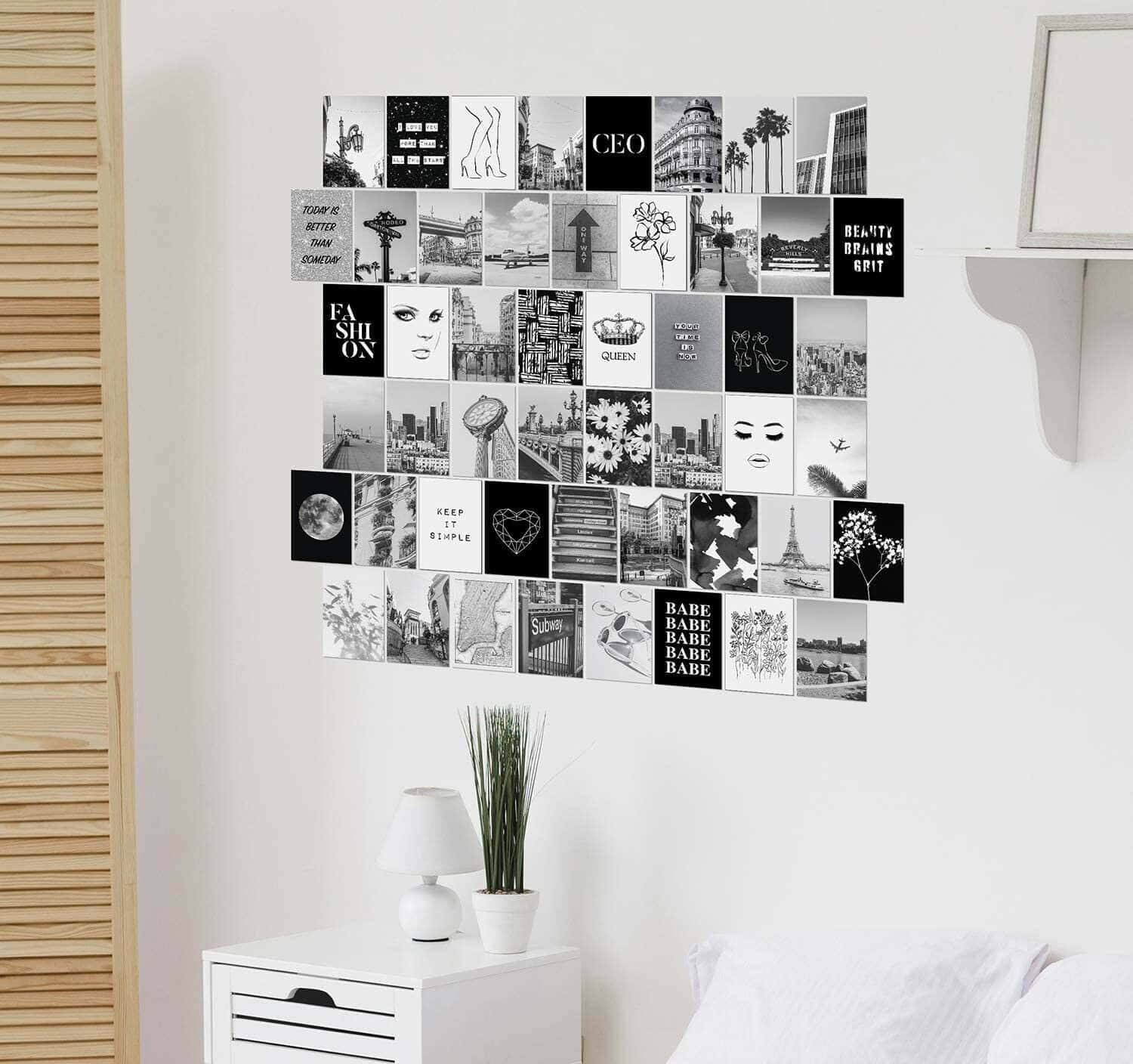 A Bedroom With A Black And White Photo Collage On The Wall