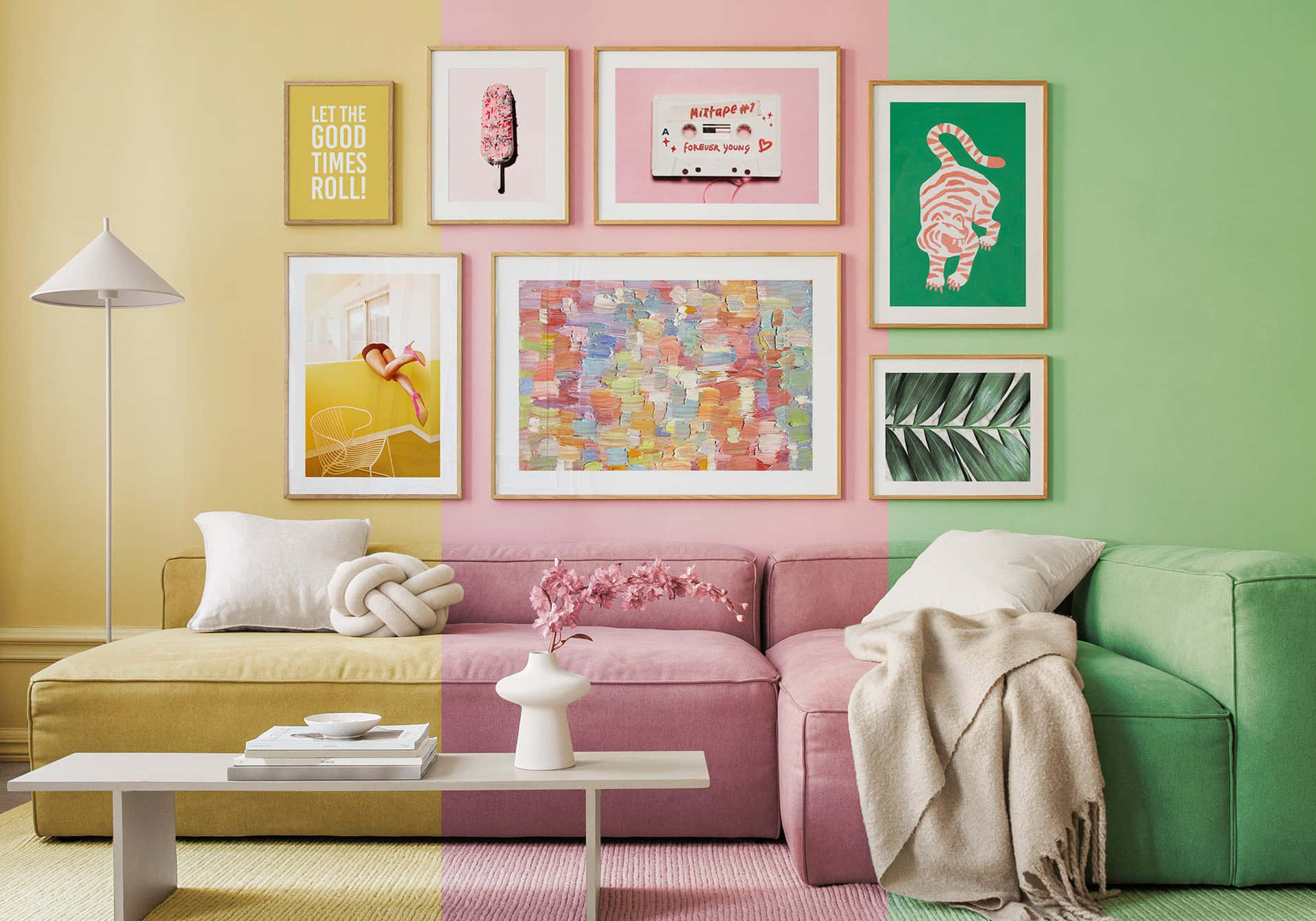 A Living Room With A Pink, Green, And Yellow Couch