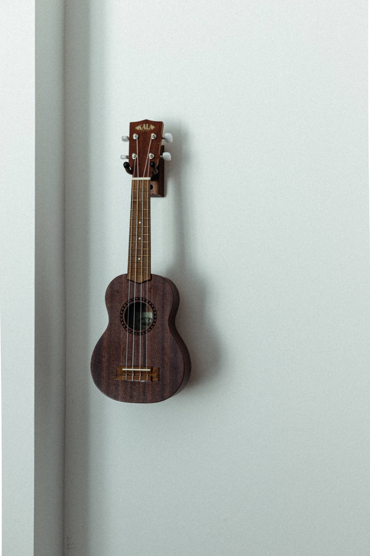 Download Wall Mounted Ukulele | Wallpapers.com