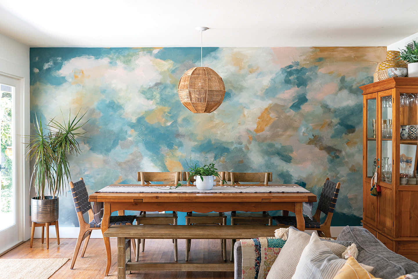 A Dining Room With A Blue And White Mural