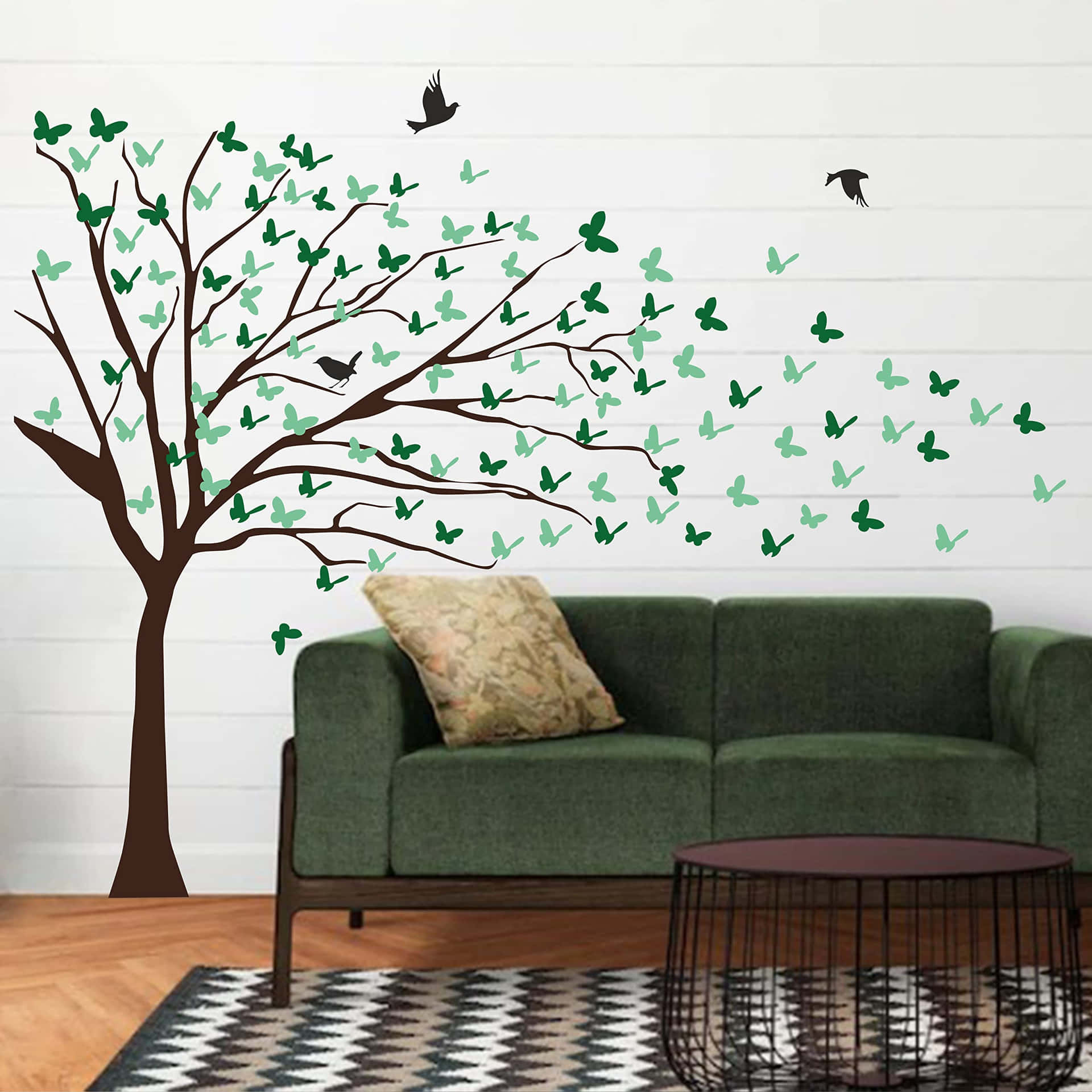 A Living Room With A Tree And Birds Flying Around It