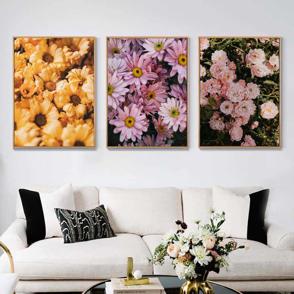 Three Floral Paintings Hanging Above A Couch