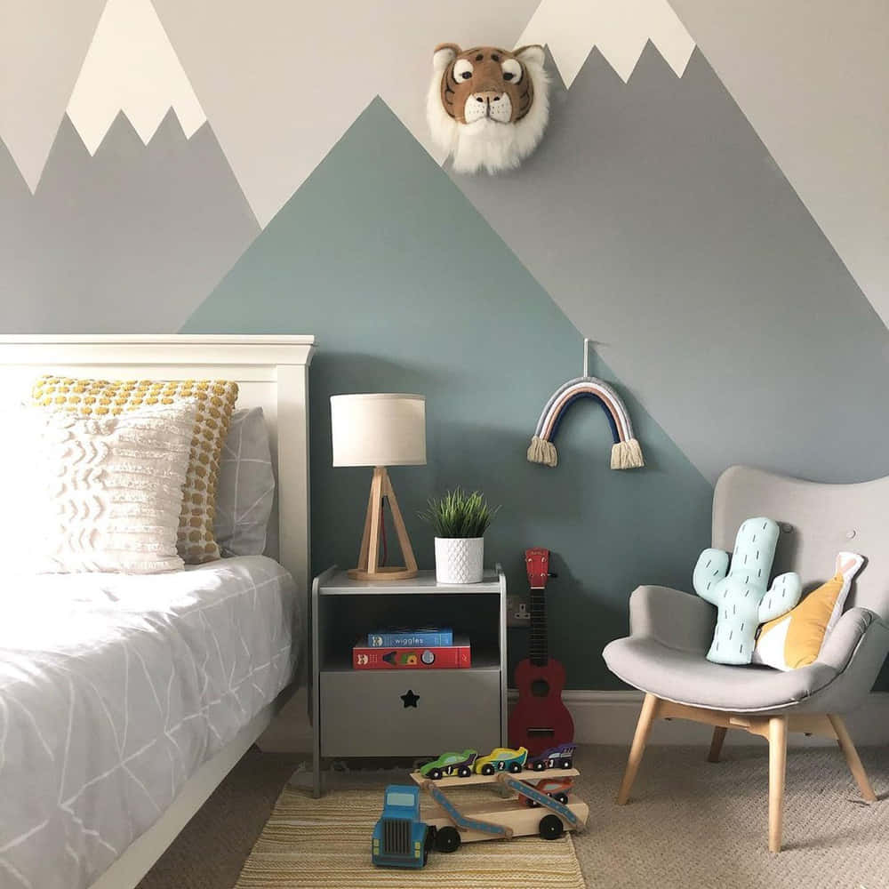 A Kids Bedroom With Mountains Painted On The Wall