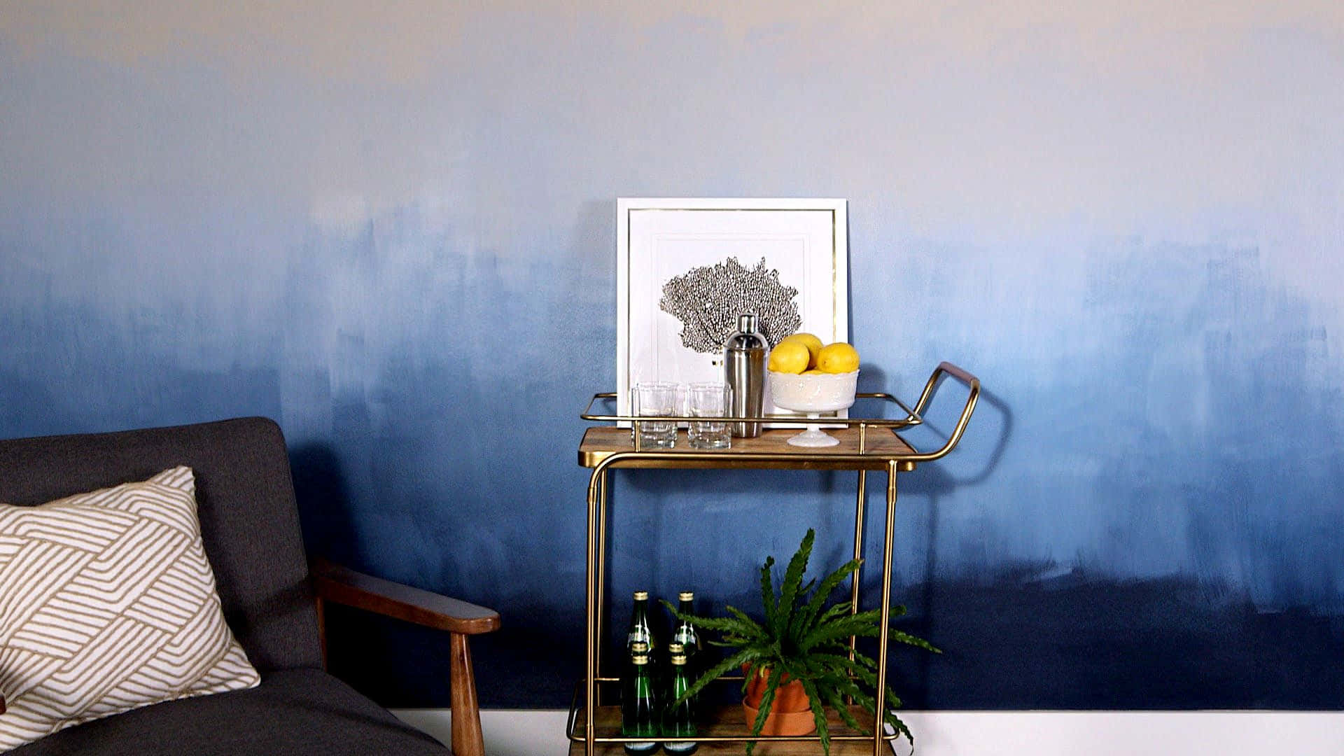 A Blue Wall With A Gold Chair