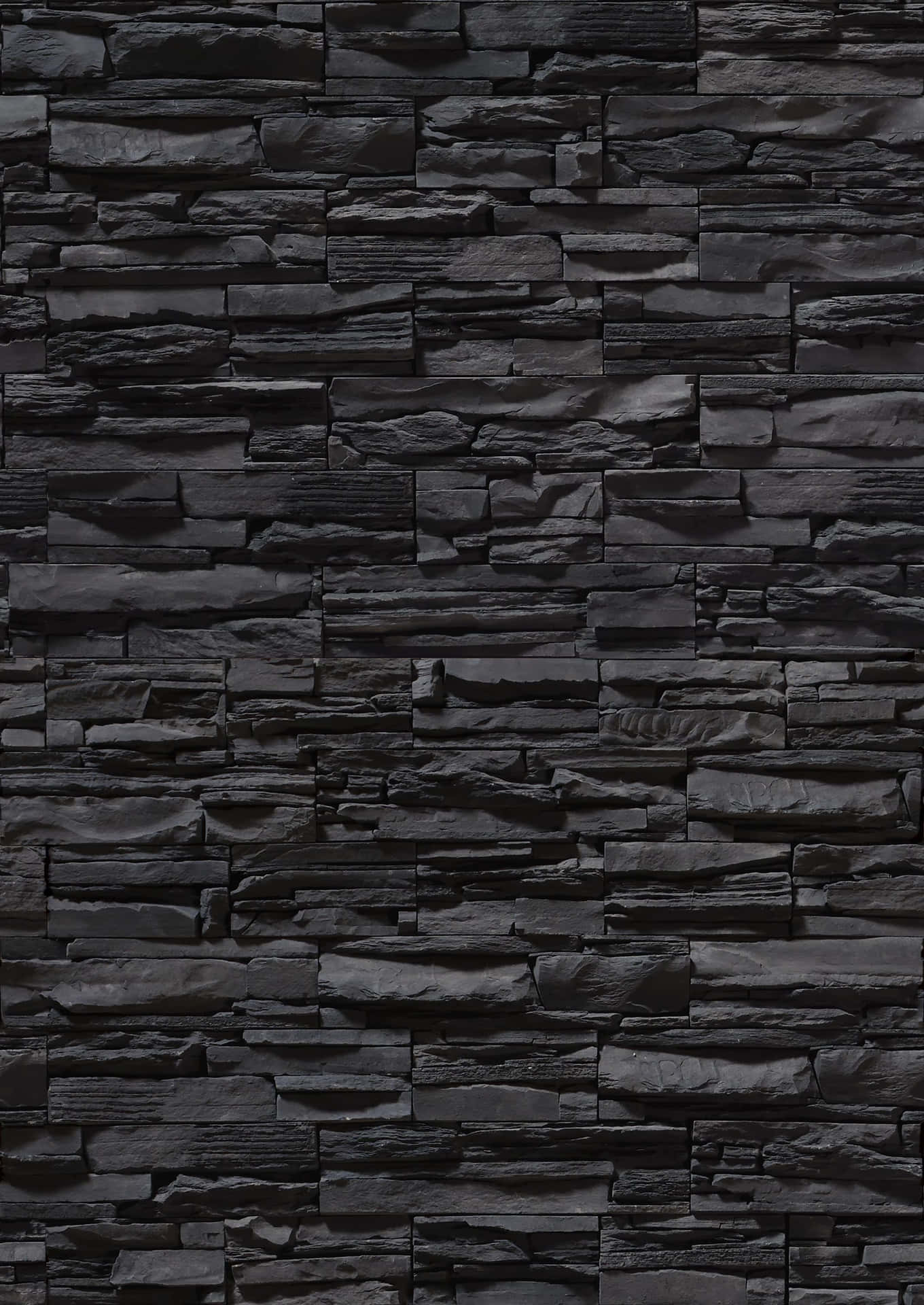 En sort stenmur med en sort baggrund