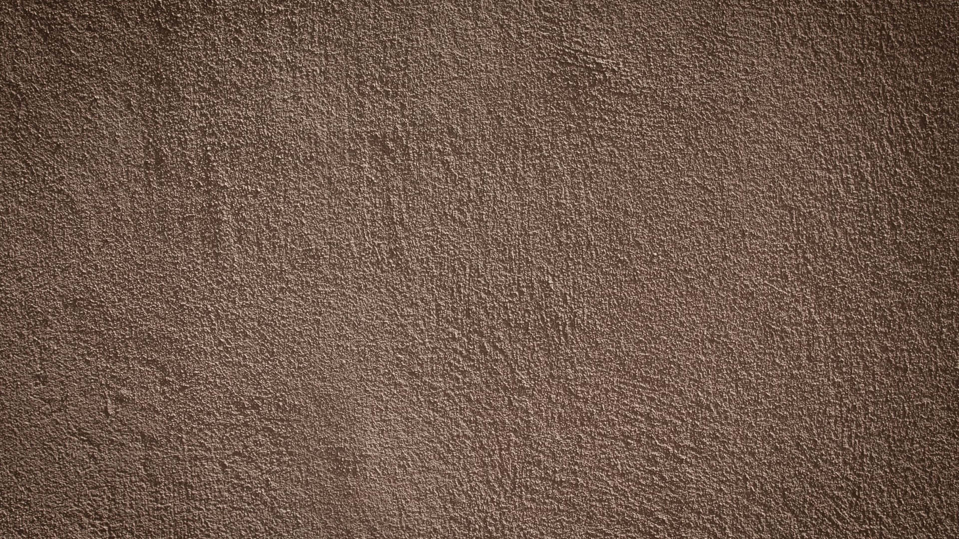 A Brown Wall With A Texture