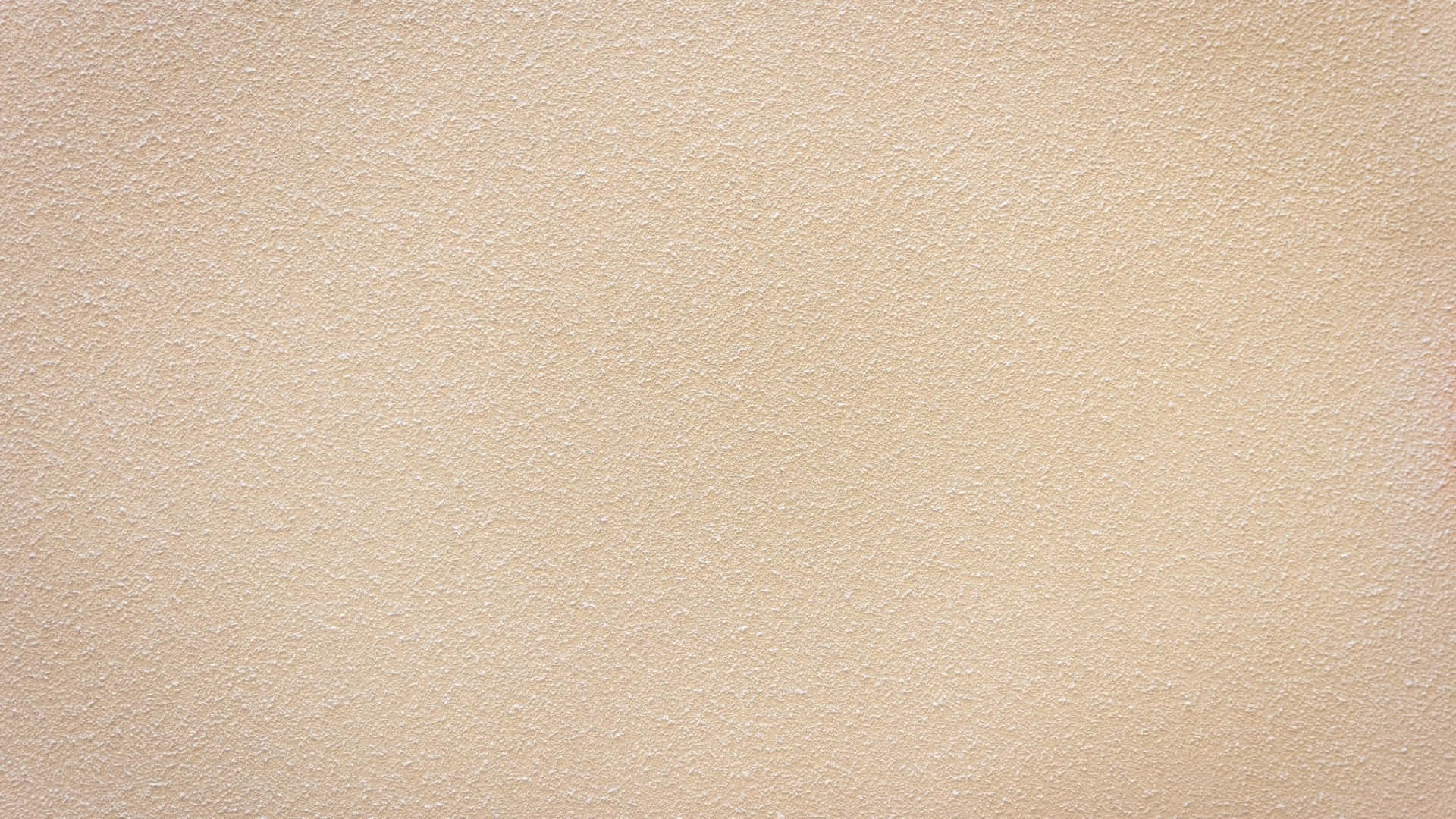 A Close Up Of A Beige Wall